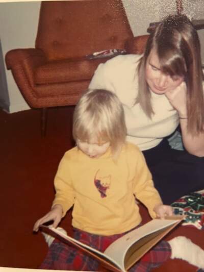 The author, at age 3, reading a book with her mother. (Courtesy Laura McTaggart)