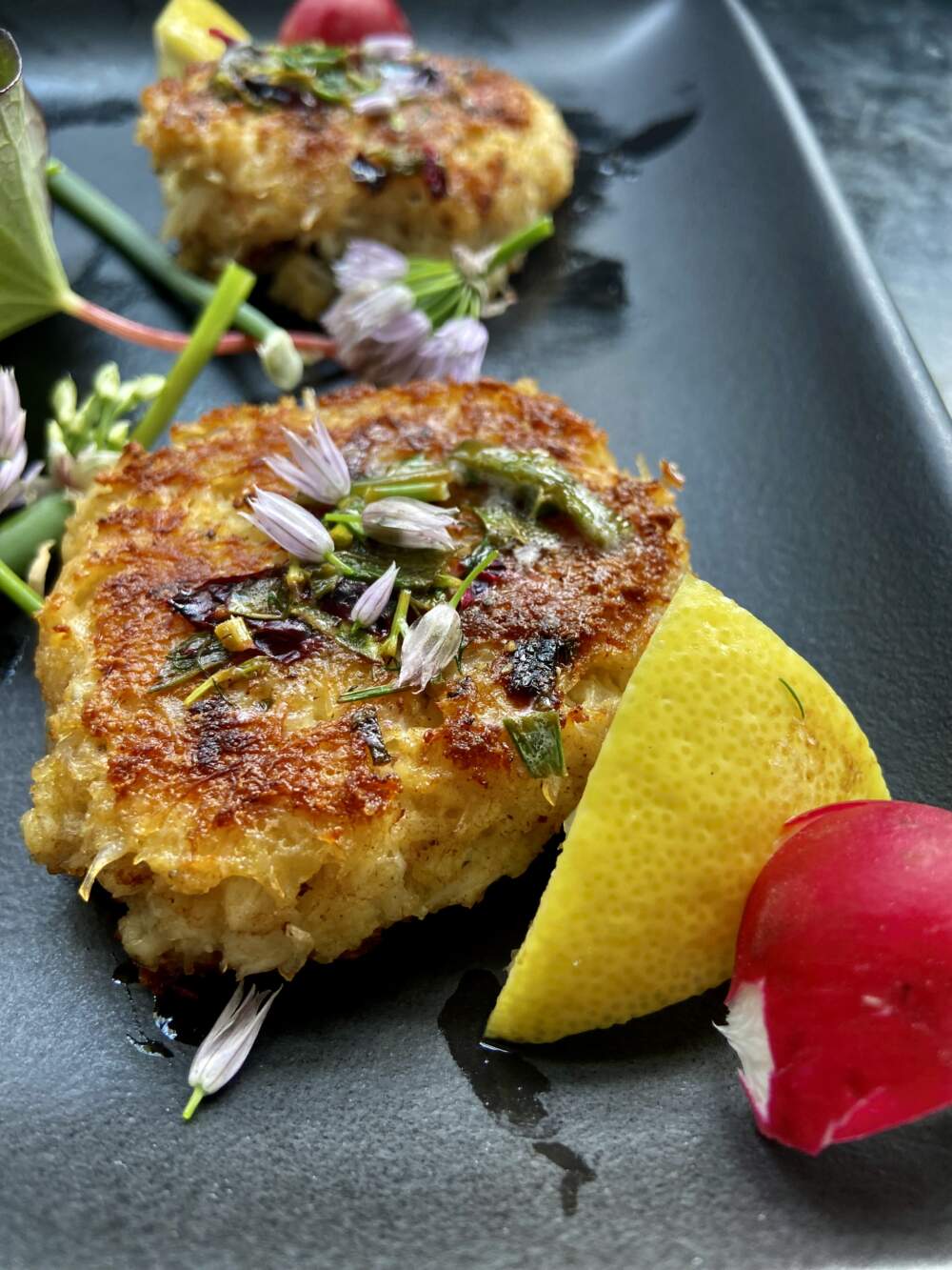 Crab cakes with herb butter. (Kathy Gunst/Here & Now)