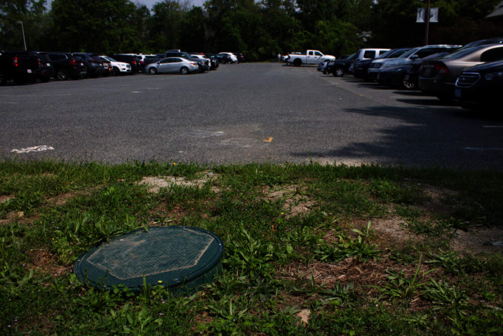 Last fall, Eversource drilled three test boreholes at the site of its networked geothermal pilot project in Framingham. When the project is complete, 113 of these boreholes will provide climate-friendly heating and cooling for 37 buildings in the neighborhood. (Miriam Wasser/WBUR)