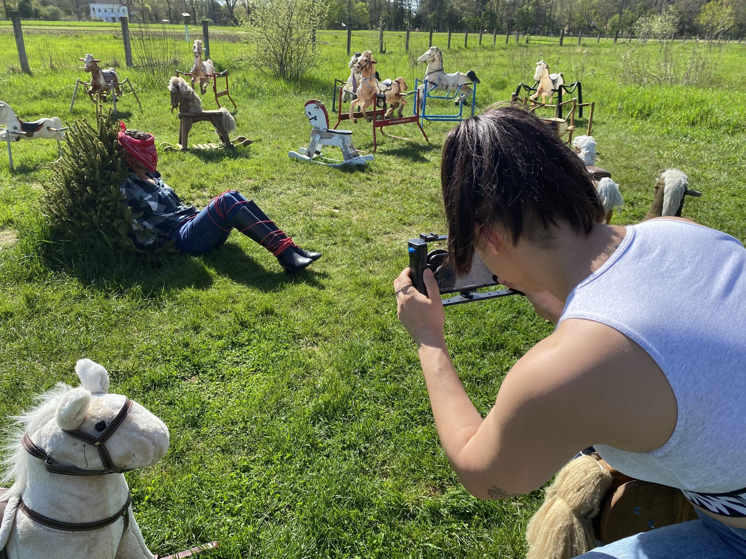 Julia Curiale filming actor Melesia Swanson Alonzo at Ponyhenge. Their short movie "Outlaw Ink" is a tale of revenge. (Andrea Shea/WBUR)