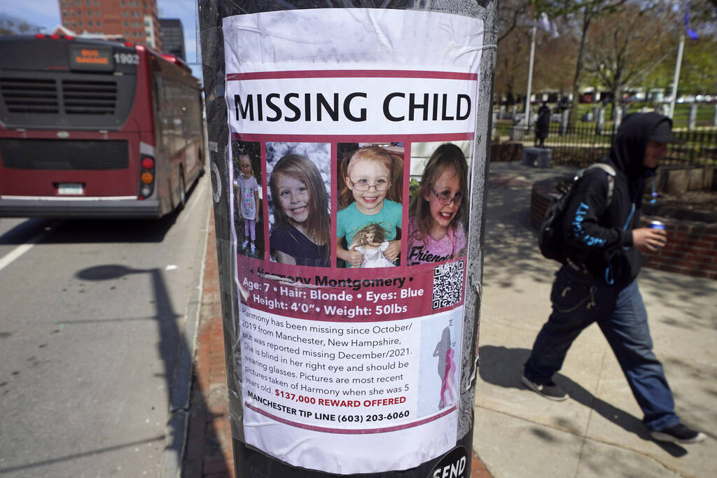 A man walks past the &quot;missing child&quot; poster for Harmony Montgomery on May 5, 2022, in Manchester, New Hampshire. (Charles Krupa/AP)