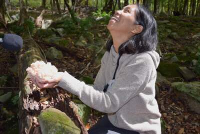 Ria showing off a bear tooth mushroom (Courtesy Megan Cattel)