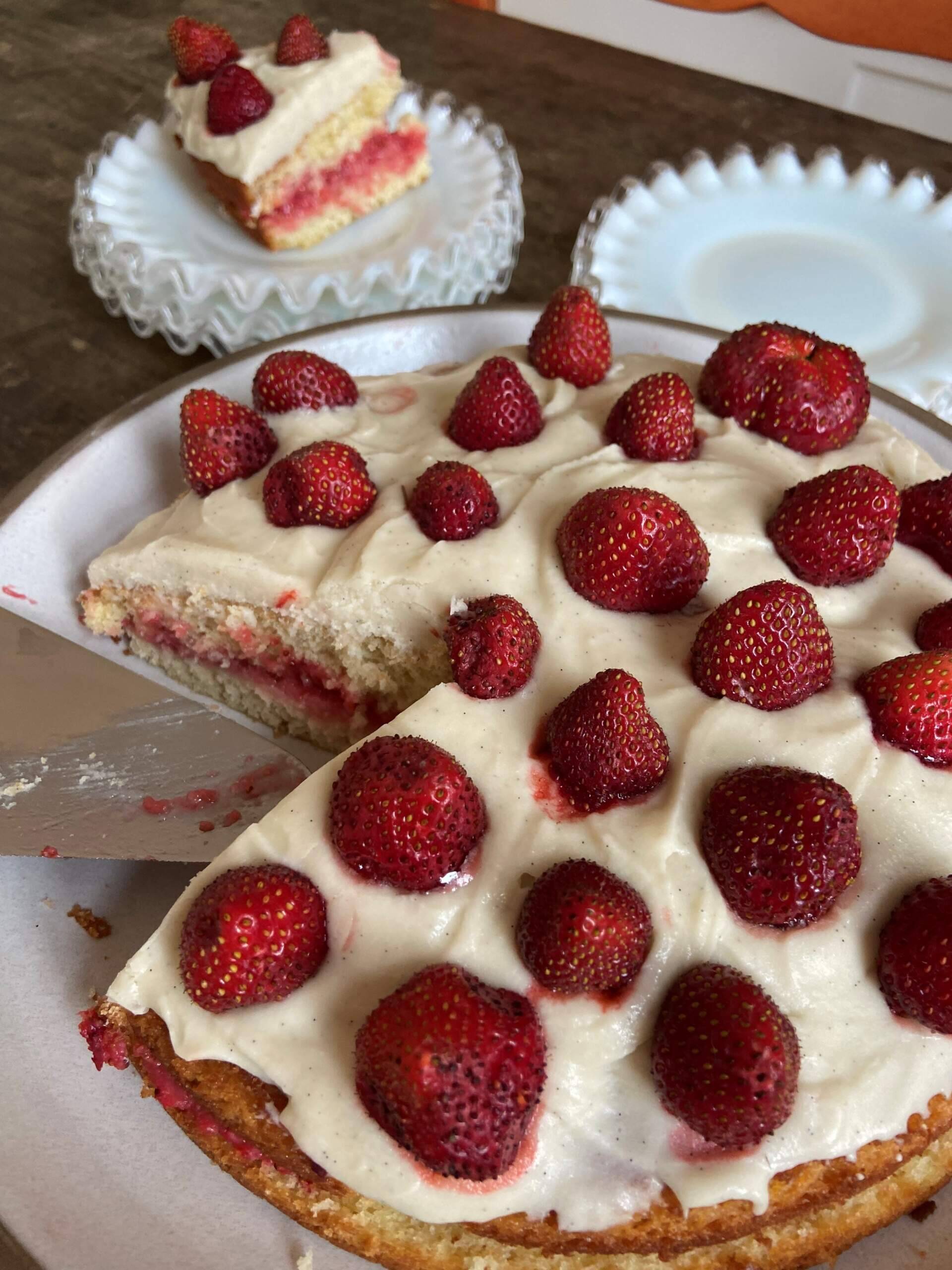 Vanilla cake with strawberry preserves, vanilla frosting and strawberries. (Kathy Gunst/Here &amp; Now)