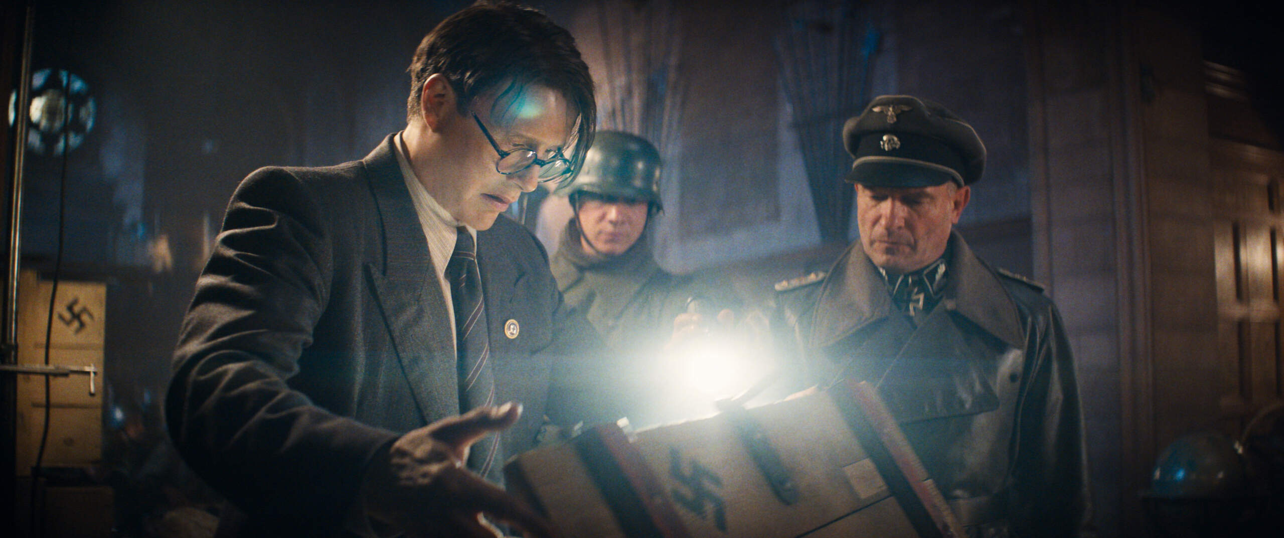 (Clockwise from right): Colonel Weber (Thomas Kretschmann) and Doctor Jürgen Voller (Mads Mikkelsen) in Lucasfilm's “Indiana Jones and the Dial of Destiny.” (Courtesy Lucasfilm Ltd., TM.)