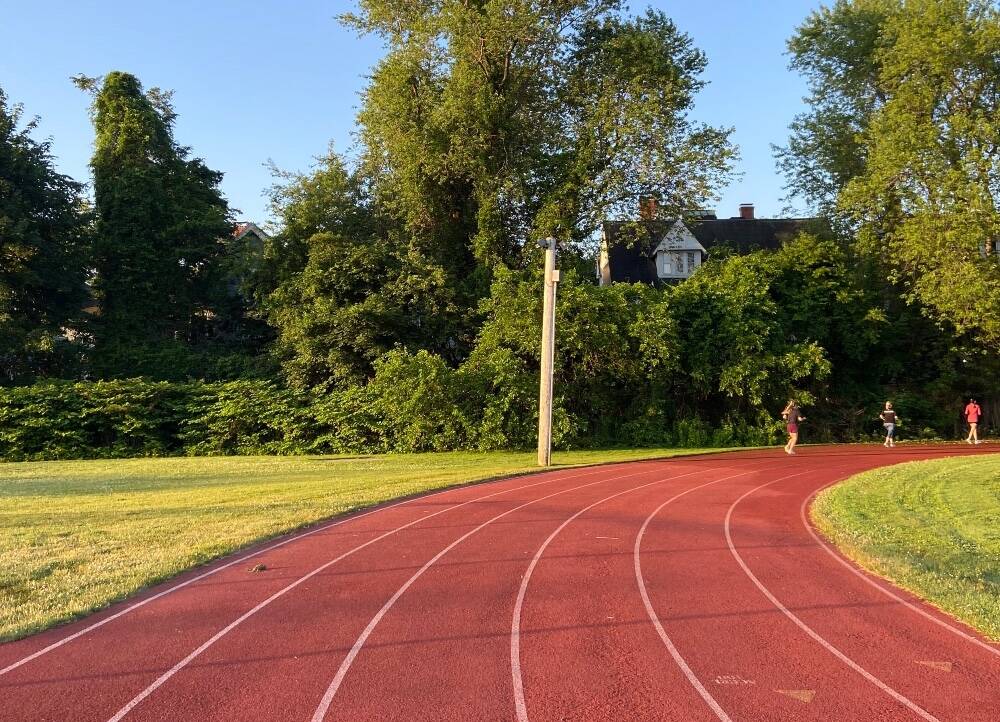 “Every Monday, before my kids wake up, I head to the track, running indoors through the New England winters and outdoors through the summer humidity.” Rhode Island, 2023. (Courtesy Stephanie Gorton)