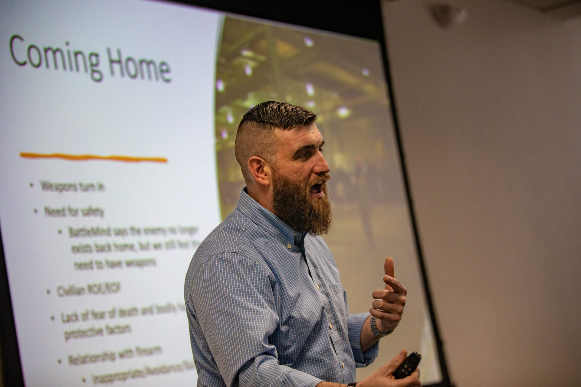 Instructor Kevin Lambert, who is a psychology student at William James College, served in the Army and did a tour in Iraq, discusses military and veteran firearm culture. (Jesse Costa/WBUR)