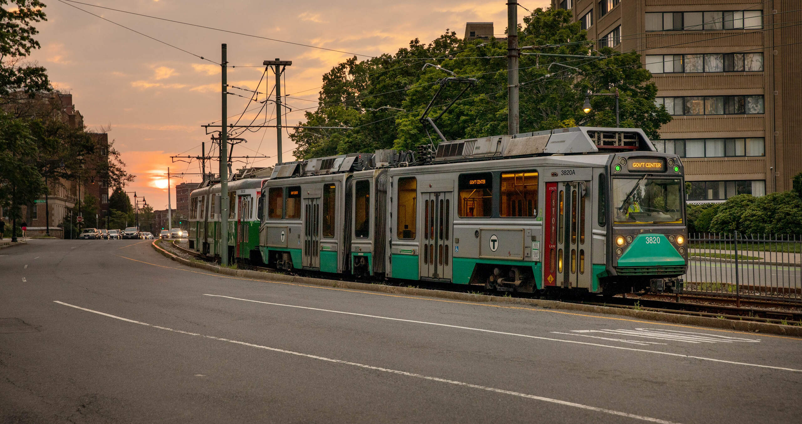 A Green Line MBTA train makes its way along Commonwealth Avenue in Brighton. (Robin Lubbock/WBUR)