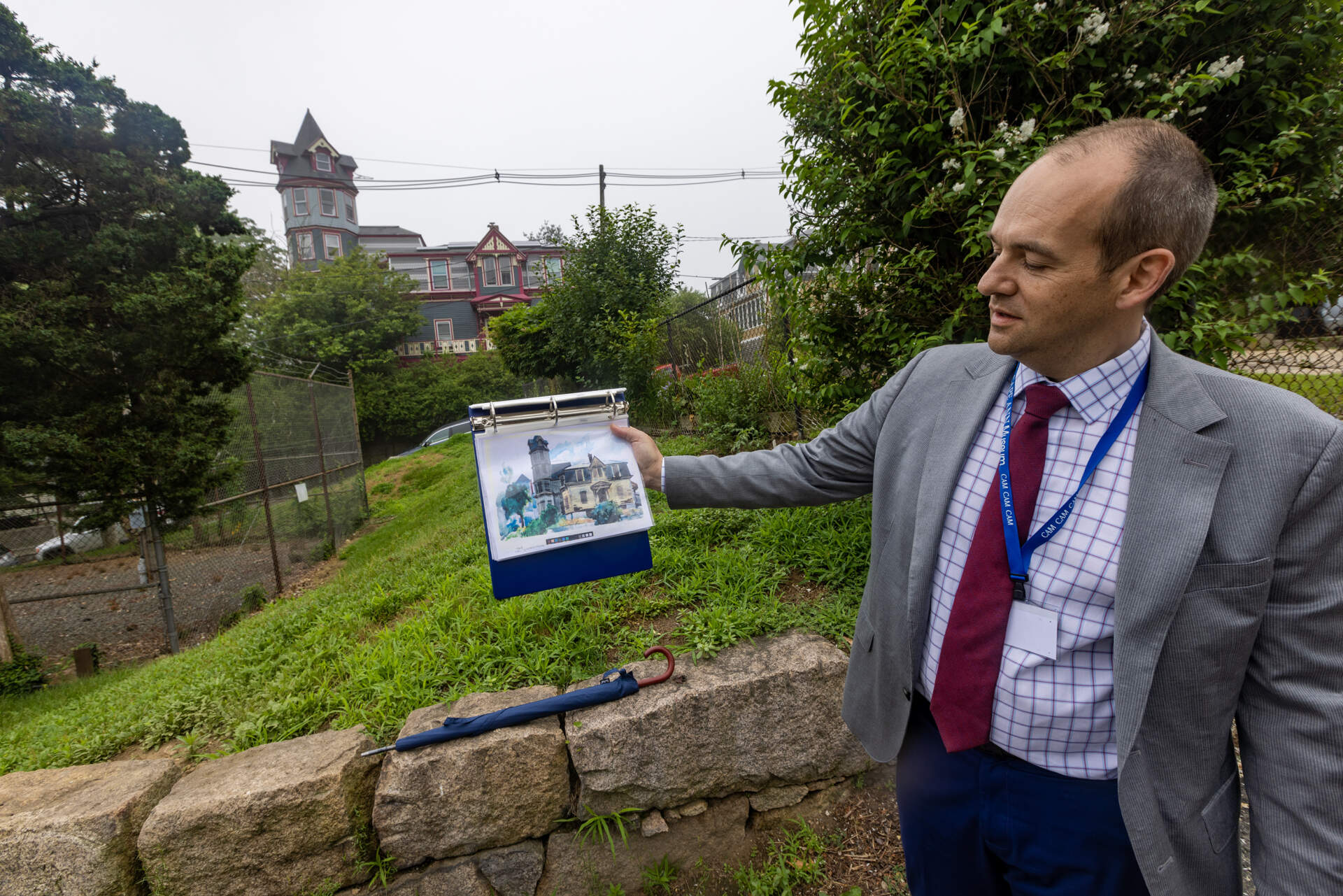 Cape Ann Museum Director Oliver Barker compares the view from where he is standing to Edward Hopper’s painting of the Loring Haskell House, which will be part of the walking tour around the city. (Jesse Costa/WBUR)