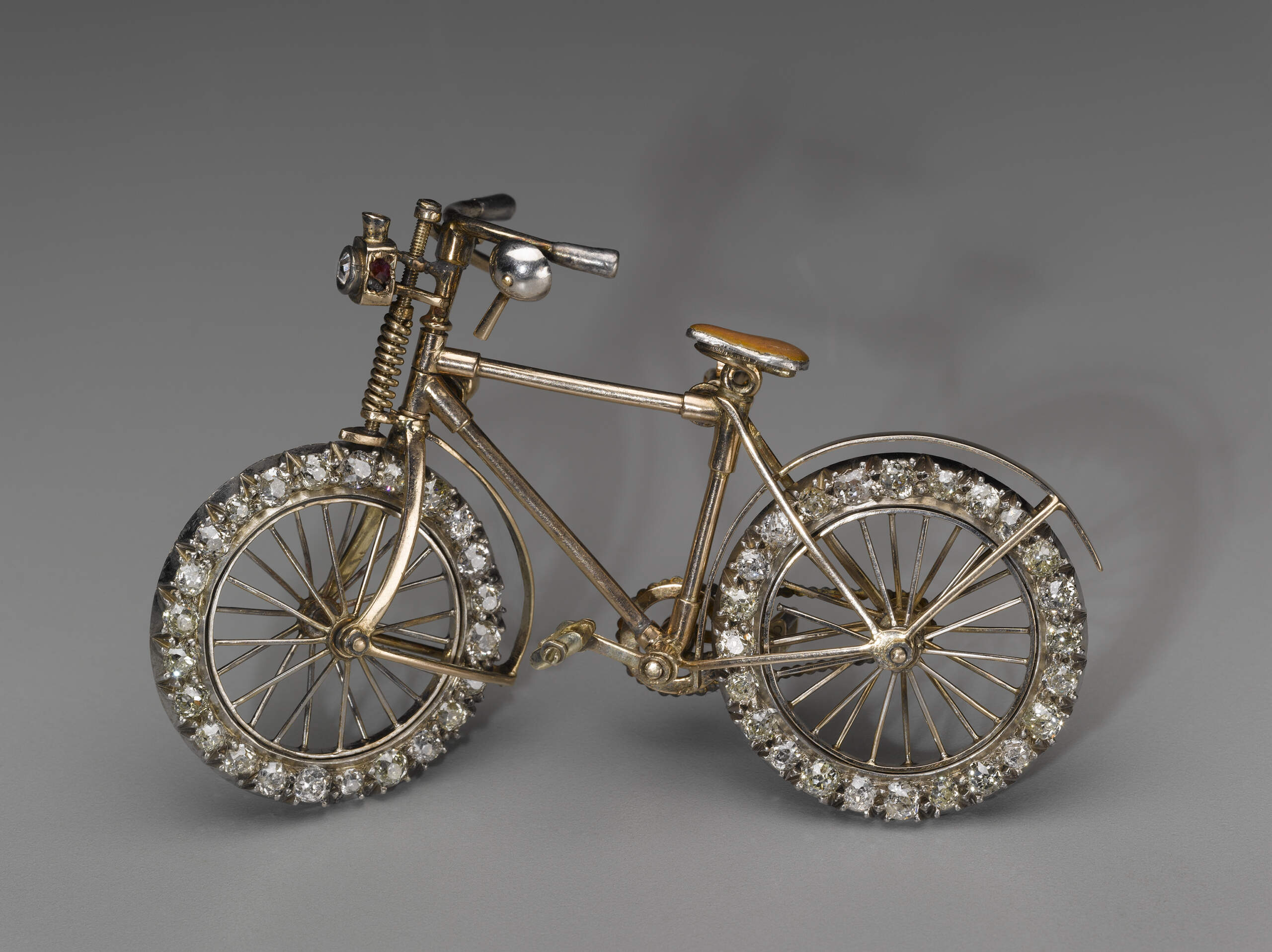 Streeter & Co., LTD (English) possibly made this "Bicycle brooch" in the mid–1890s. (Courtesy Museum of Fine Arts, Boston)