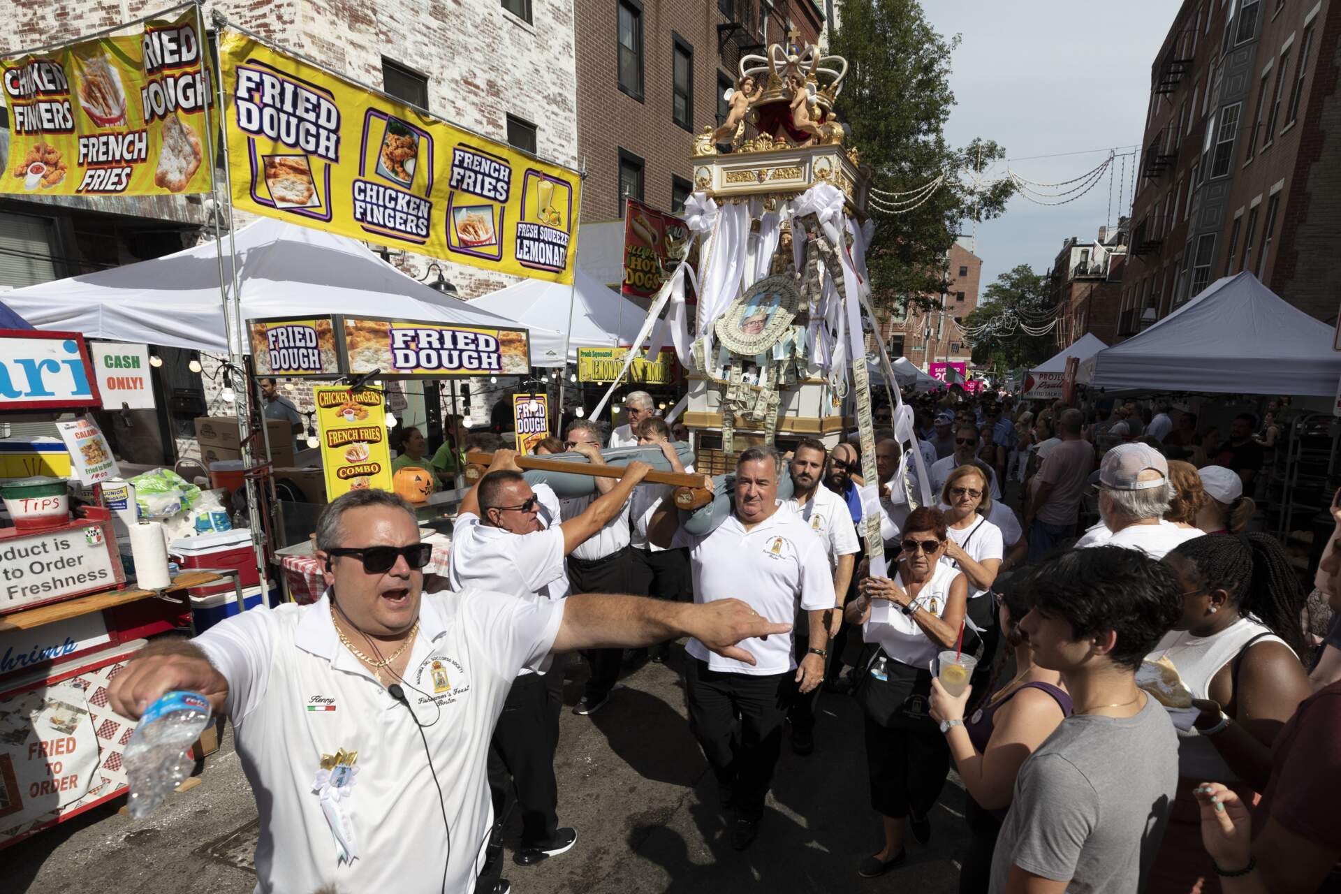 Members of the Madonna Del Soccorso Society carry a statue of the Madonna during the annual Fisherman's Feast in 2022. (Michael Dwyer/AP)