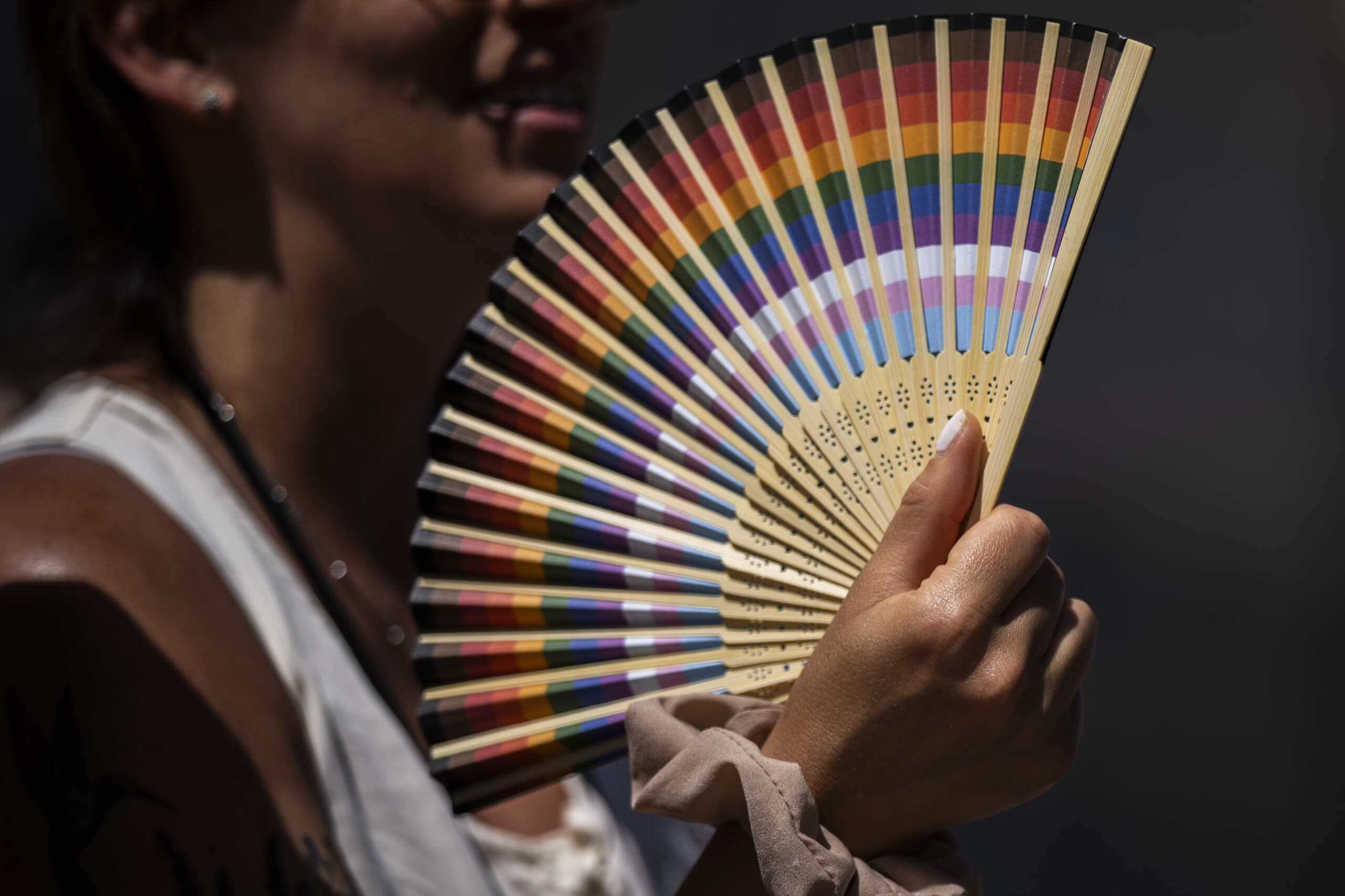A woman fans herself in Madrid, Spain, Monday, July 10, 2023. (Bernat Armangue/AP)