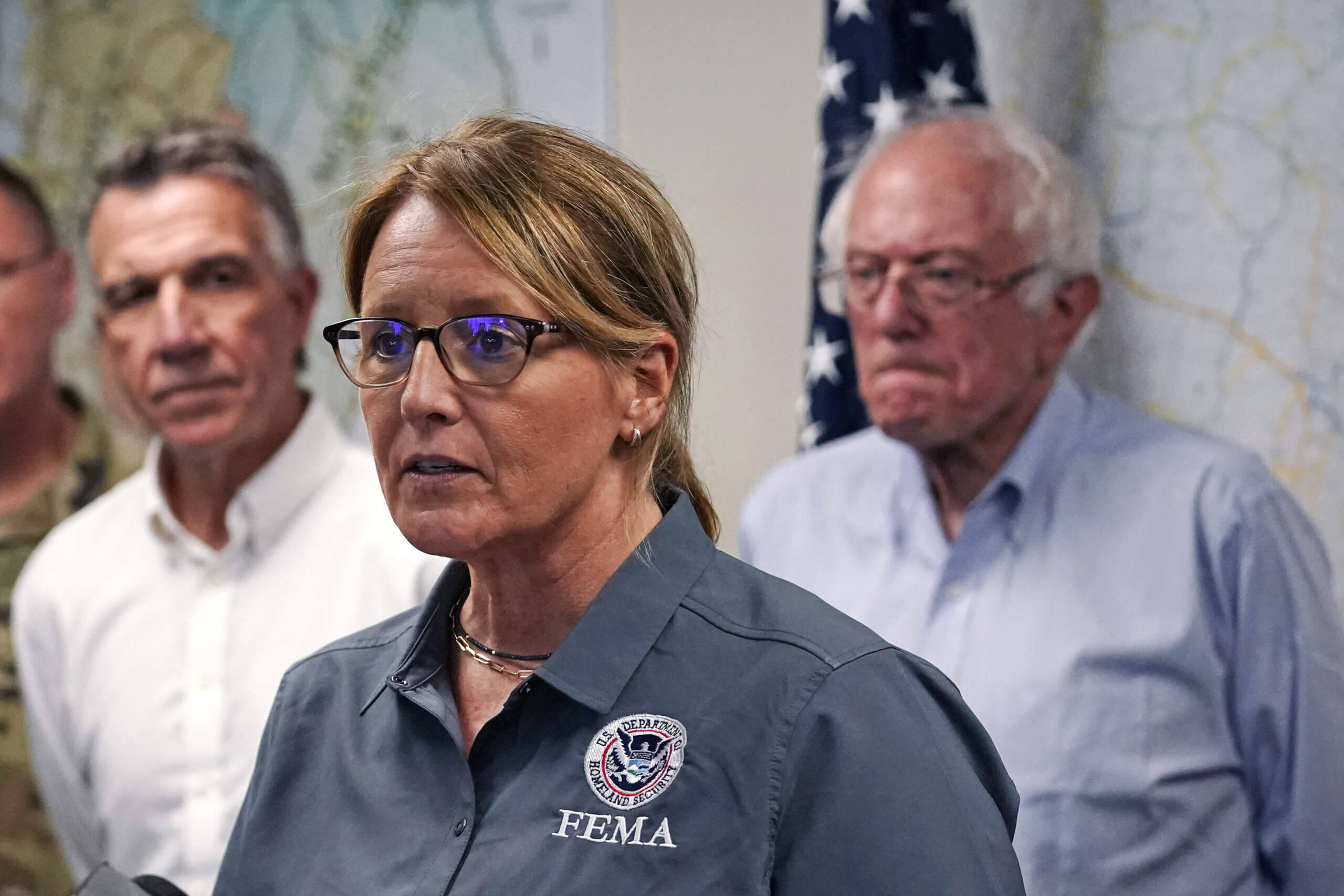 FEMA Administrator Deanne Criswell, center, addresses reporters flanked by Vermont Gov. Phil Scott, left, and U.S. Sen. Bernie Sanders, I-VT, Wednesday, July 12, 2023, in Berlin, Vt. (Charles Krupa/AP)