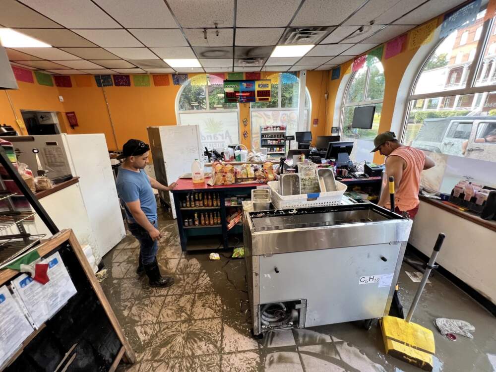 Jose Dominguez, left, helps clean up Arandas restaurant inside a Sunoco in Montpelier on Tuesday, July 11. (Brian Stevenson And Kyle Ambusk/Vermont Public)