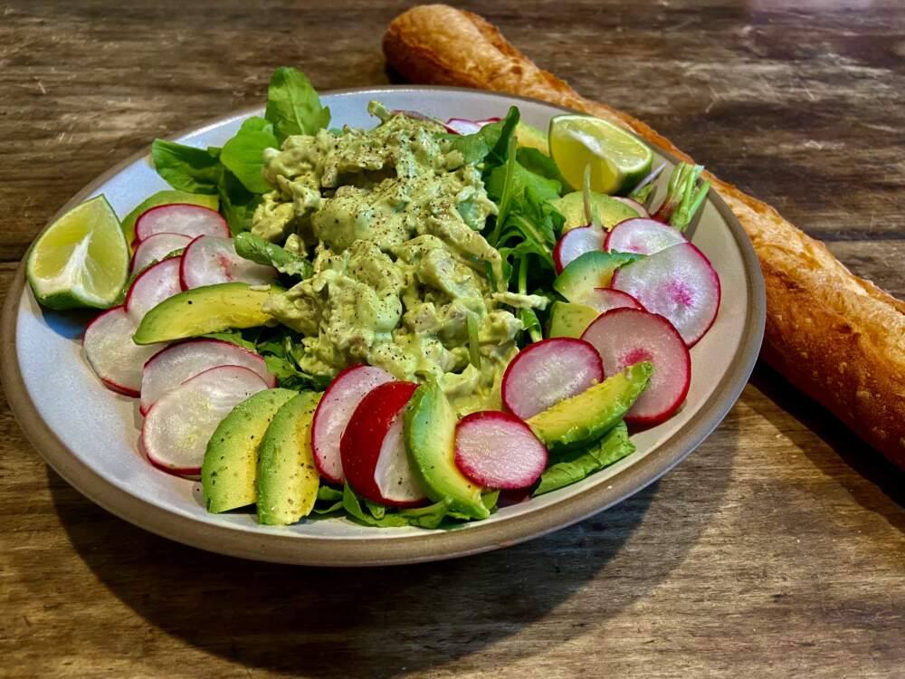 Chicken salad with avocado-lime mayonnaise with arugula, avocado and radishes. (Kathy Gunst/Here & Now)