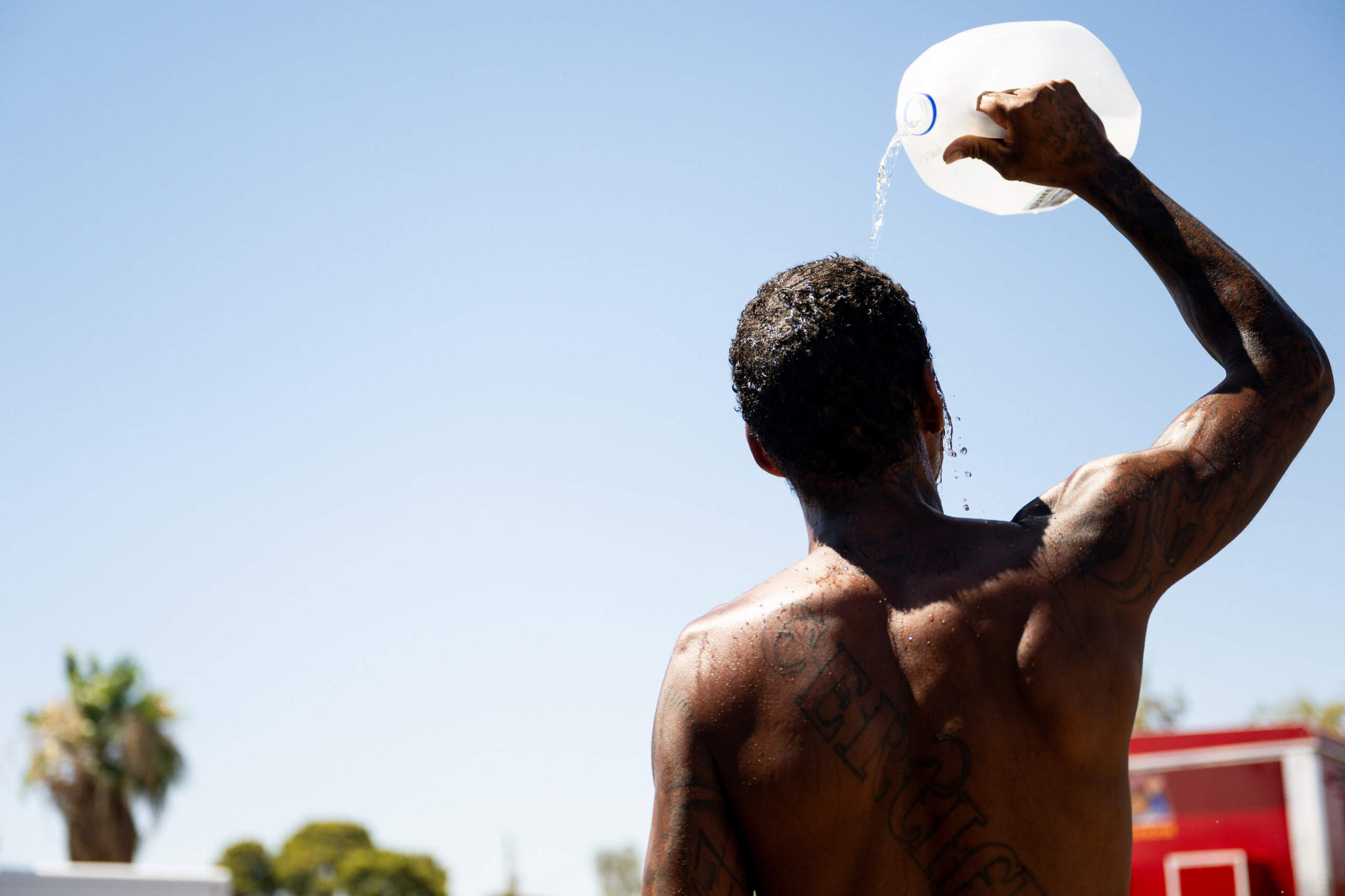 A person cools off amid searing heat that was forecast to reach 115 degrees Fahrenheit on July 16, 2023 in Phoenix, Arizona. (Brandon Bell/Getty Images)