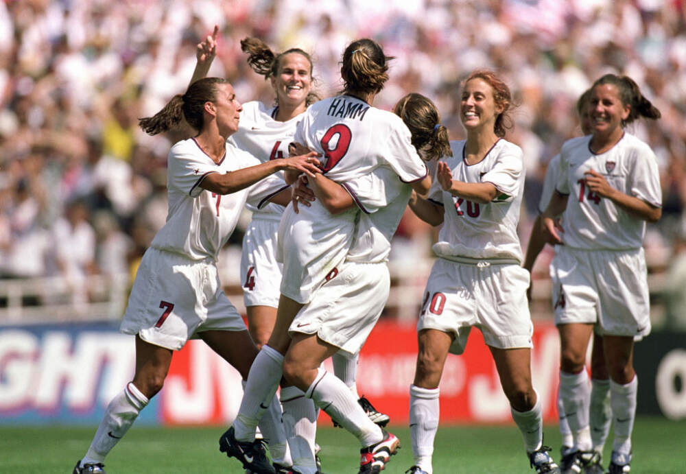 PASADENA, CA - JULY 10: Mia Hamm #9 of Team USA  and teammates celebrate the victory over Team China in the Final match of the FIFA Women's World Cup at the Rose Bowl on July 10, 1999 in Pasadena, California. Team USA defeated Team China 5-4 in sudden death after two overtimes. (Jed Jacobsohn/Getty Images)