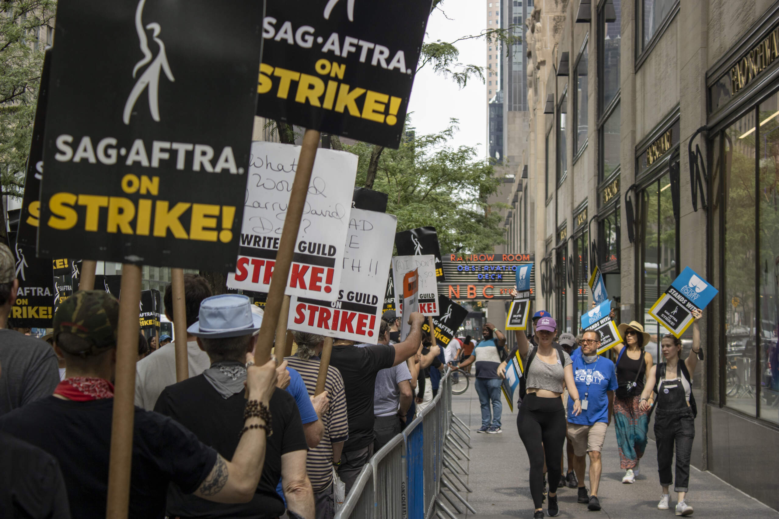 Actors, writers and supporters picket outside NBCUniversal at 30 Rockefeller Plaza in New York on Tuesday. (Ted Shaffrey/AP)