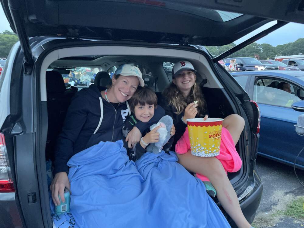 The author, and two of her three children, at a drive-in movie theater in Wellfleet, Mass. to see "Barbie" the movie. (Courtesy Sara Shukla)