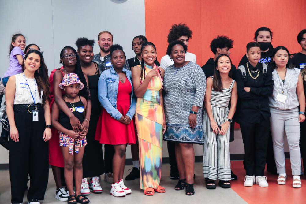 Program mentor Meshell Whyte with students who participated in the 2023 UMass Boston Summer Program in Urban Planning following their capstone presentation. (Emily Piper-Vallillo/WBUR)