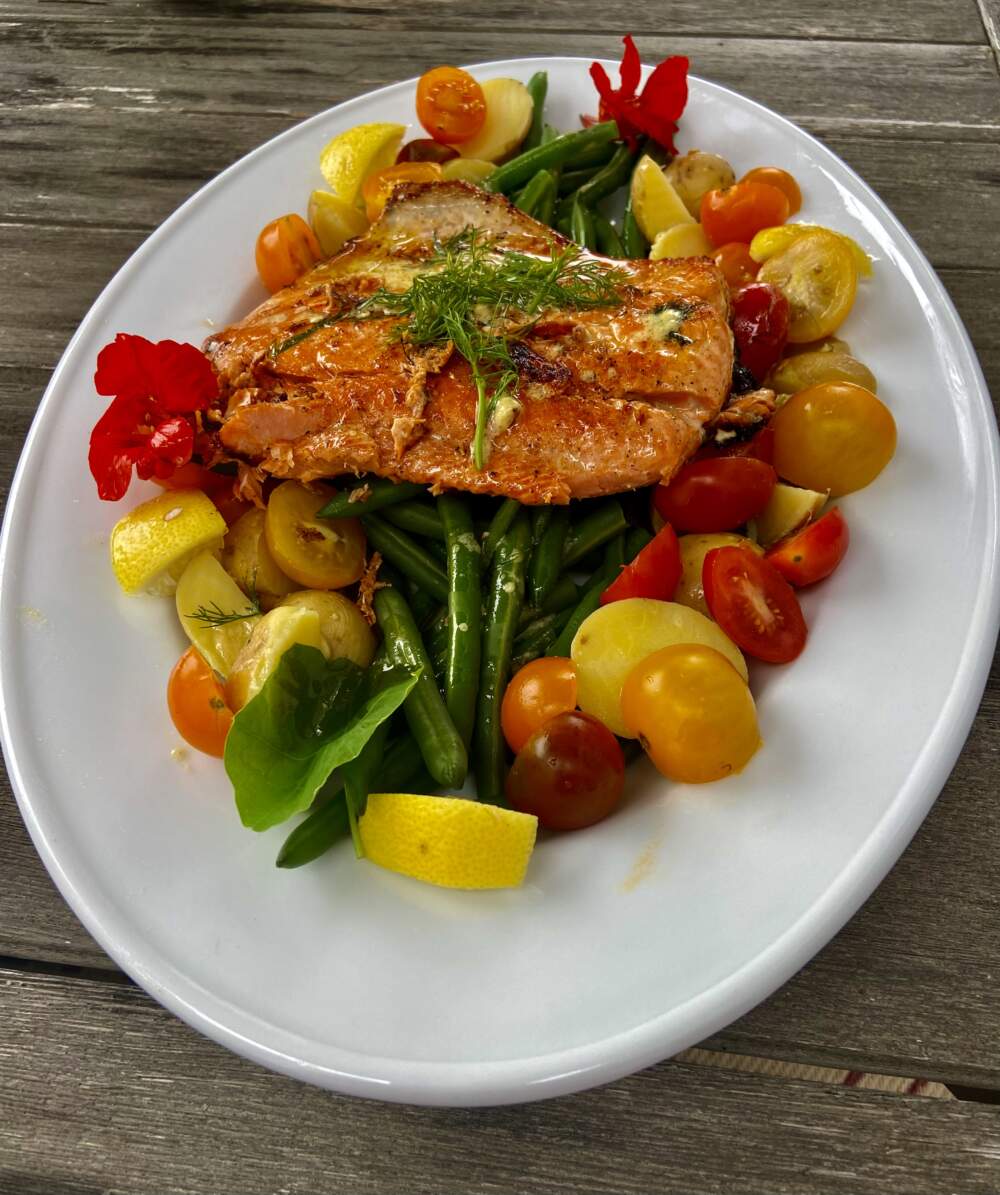 Grilled salmon with green beans, tomatoes, and potatoes with mustard-dill vinaigrette. (Kathy Gunst/Here & Now)