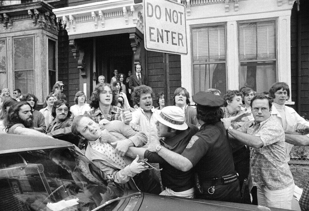 Police officers break up demonstrators outside South Boston High School on the first day of the court-ordered busing program on Sept. 12, 1974. (Peter Bregg/AP)