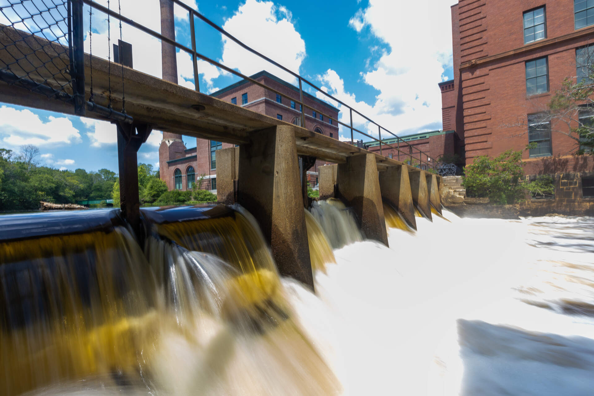 Water cascades over the Neponset River Waterfall at Lower Mills in Dorchester. (Jesse Costa/WBUR)