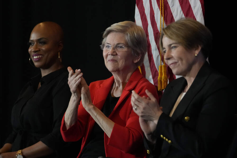 U.S. Sen. Elizabeth Warren, D-Mass., center, with U.S. Rep. Ayanna Pressley, D-Mass., left, and Mass. Gov. Maura Healey, right, during a town hall meeting in April 2023 in Boston. (Charles Krupa/AP)