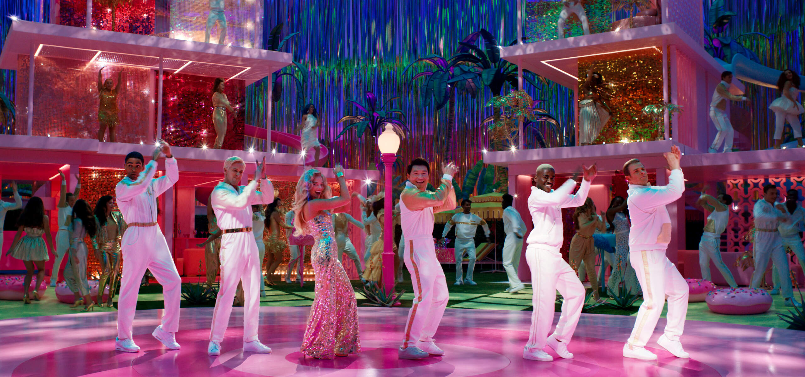 Kingsley Ben-Adir as Ken, Ryan Gosling as Ken, Margot Robbie as Barbie, Simu Liu as Ken, Ncuti Gatwa as Ken and Scott Evans as Ken in Warner Bros. Pictures' "BARBIE." (Courtesy Warner Bros.)