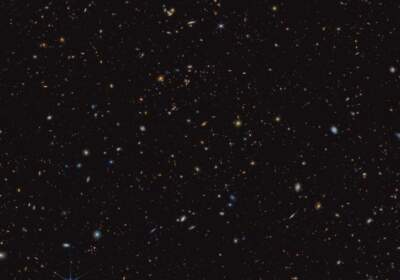 This image shows a portion of an area of the sky known as GOODS-South. More than 45,000 galaxies are visible here. Using these and other data, the JADES team has discovered hundreds of galaxies that existed when the universe was less than 600 million years old. (NASA)
