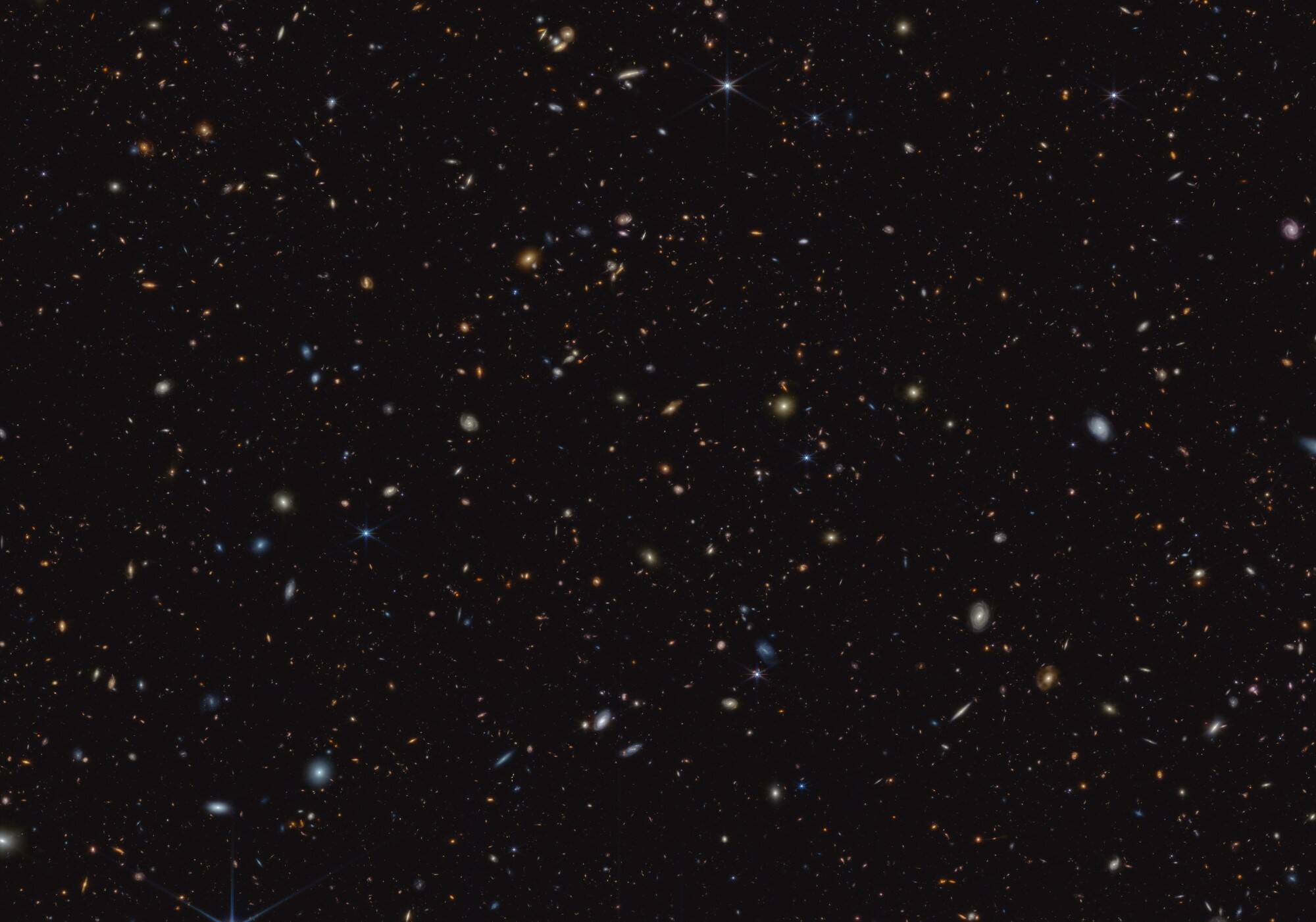 This image shows a portion of an area of the sky known as GOODS-South. More than 45,000 galaxies are visible here. Using these and other data, the JADES team has discovered hundreds of galaxies that existed when the universe was less than 600 million years old. (NASA)