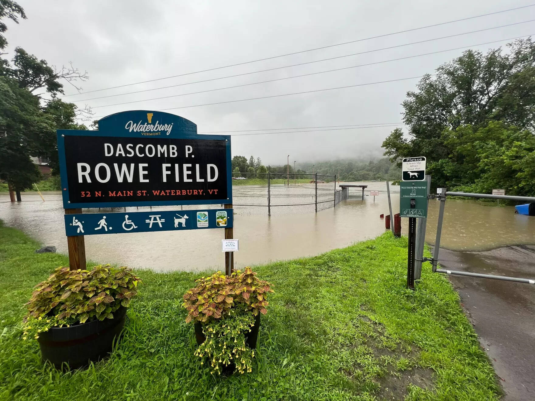 Rising waters on Dascomb Rowe Field in Waterbury inch toward Route 2 on Monday afternoon. (Brian Stevenson/Vermont Public)