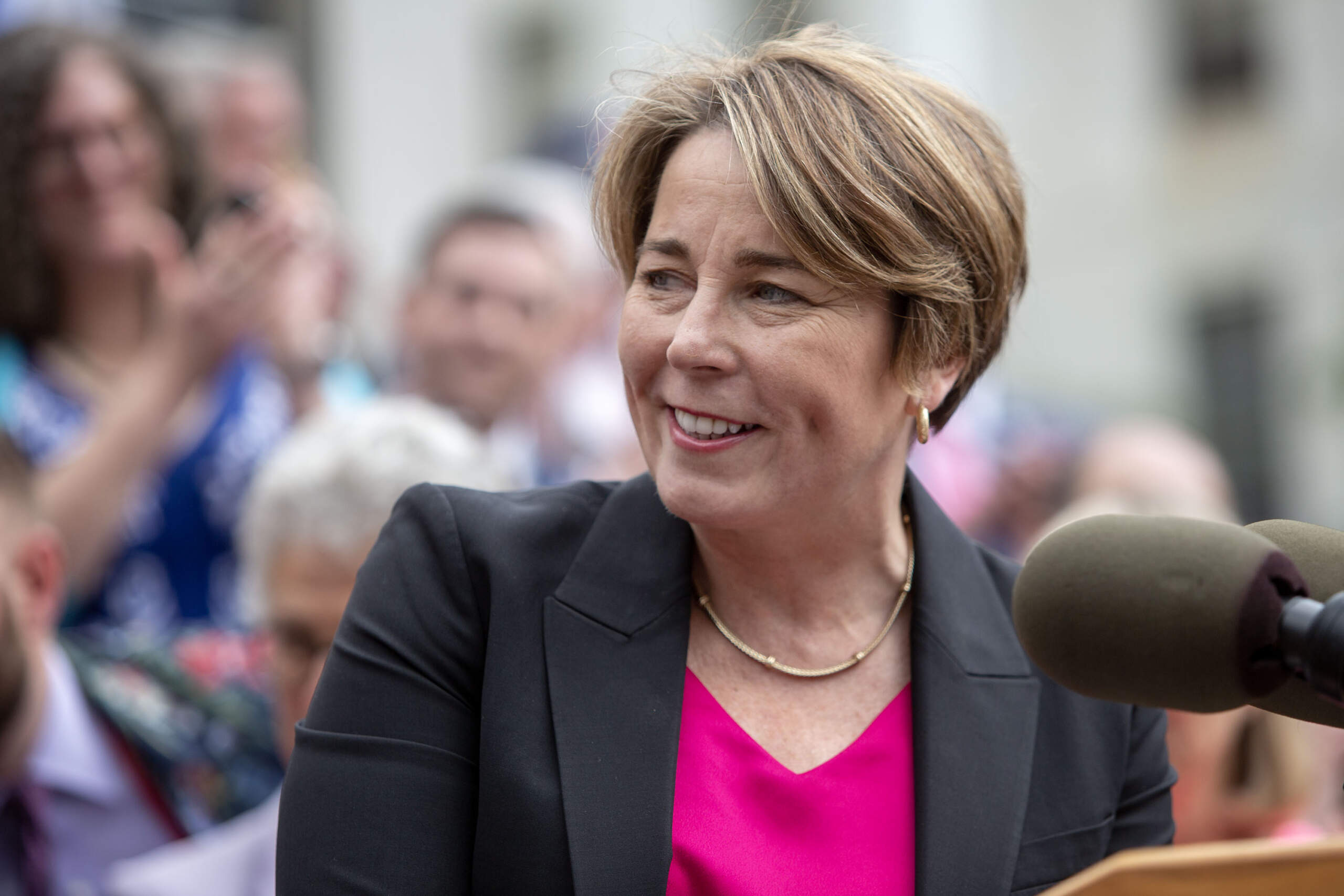 Governor Maura Healey speaks in front of the Massachusetts State House. (Robin Lubbock/WBUR)