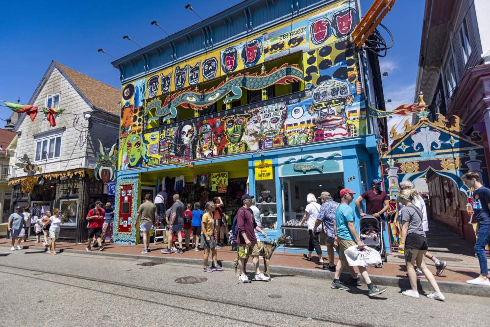 Tourists walk past Shop Therapy on Commercial Street in Provincetown. (Jesse Costa/WBUR)