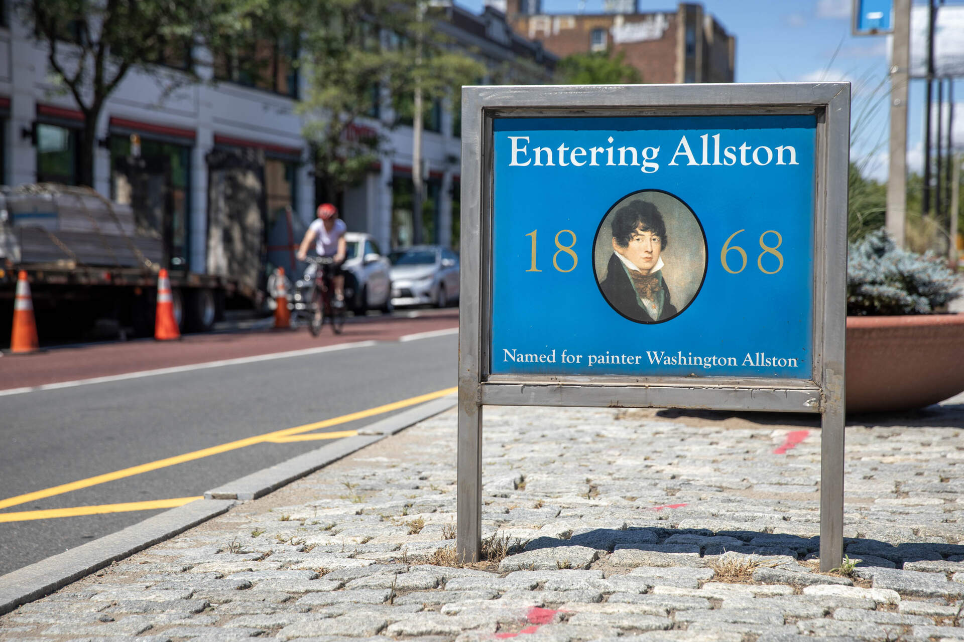 A sign on Brighton Avenue welcomes visitors to Allston. (Robin Lubbock/WBUR)