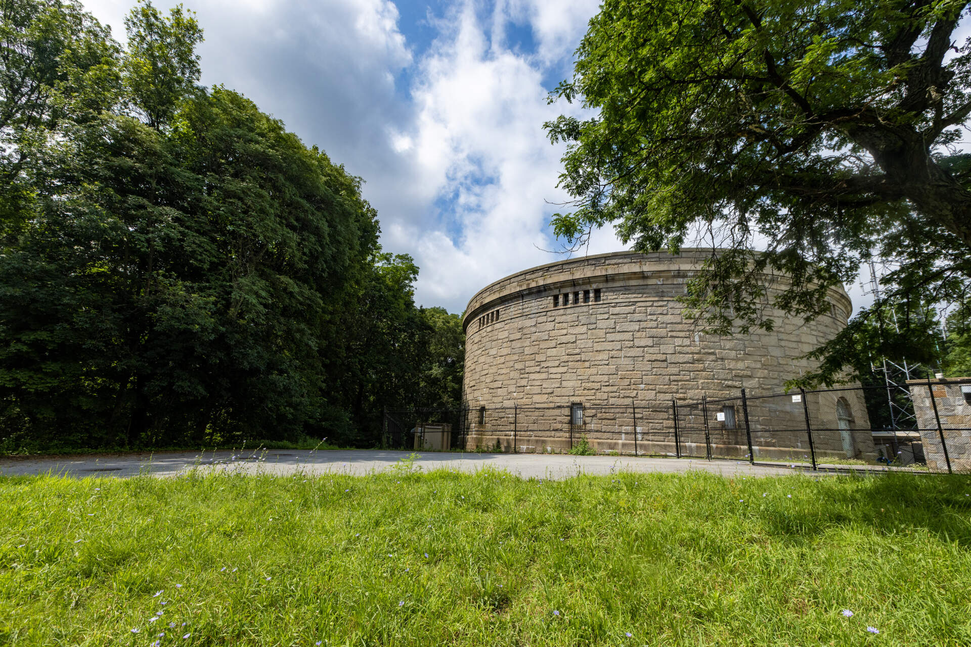 Bellevue Standpipe, a historic water storage tank built in the early 20th century on Bellevue Hill in the Stony Brook Reservation in West Roxbury. It is still in use today as stand-by water storage to a newer one. Trails wind throughout the reservation. (Jesse Costa/WBUR)