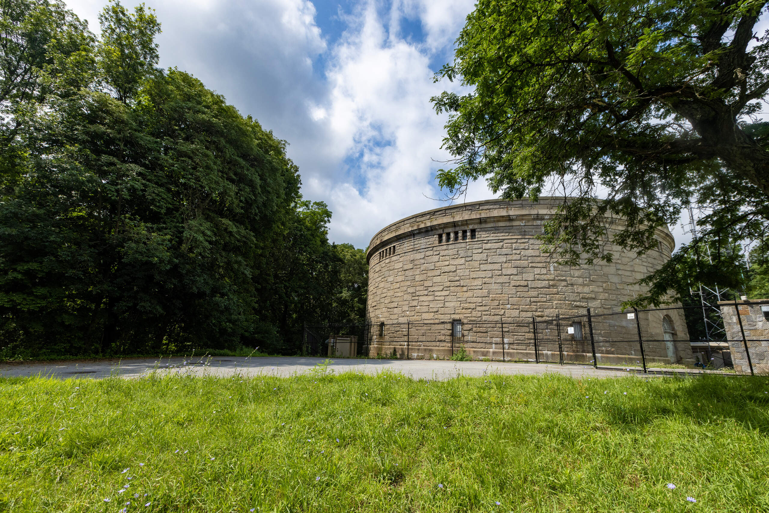 Bellevue Standpipe, a historic water storage tank built in the early 20th century on Bellevue Hill in the Stony Brook Reservation in West Roxbury. It is still in use today as stand-by water storage to a newer one. Trails wind throughout the reservation. (Jesse Costa/WBUR)