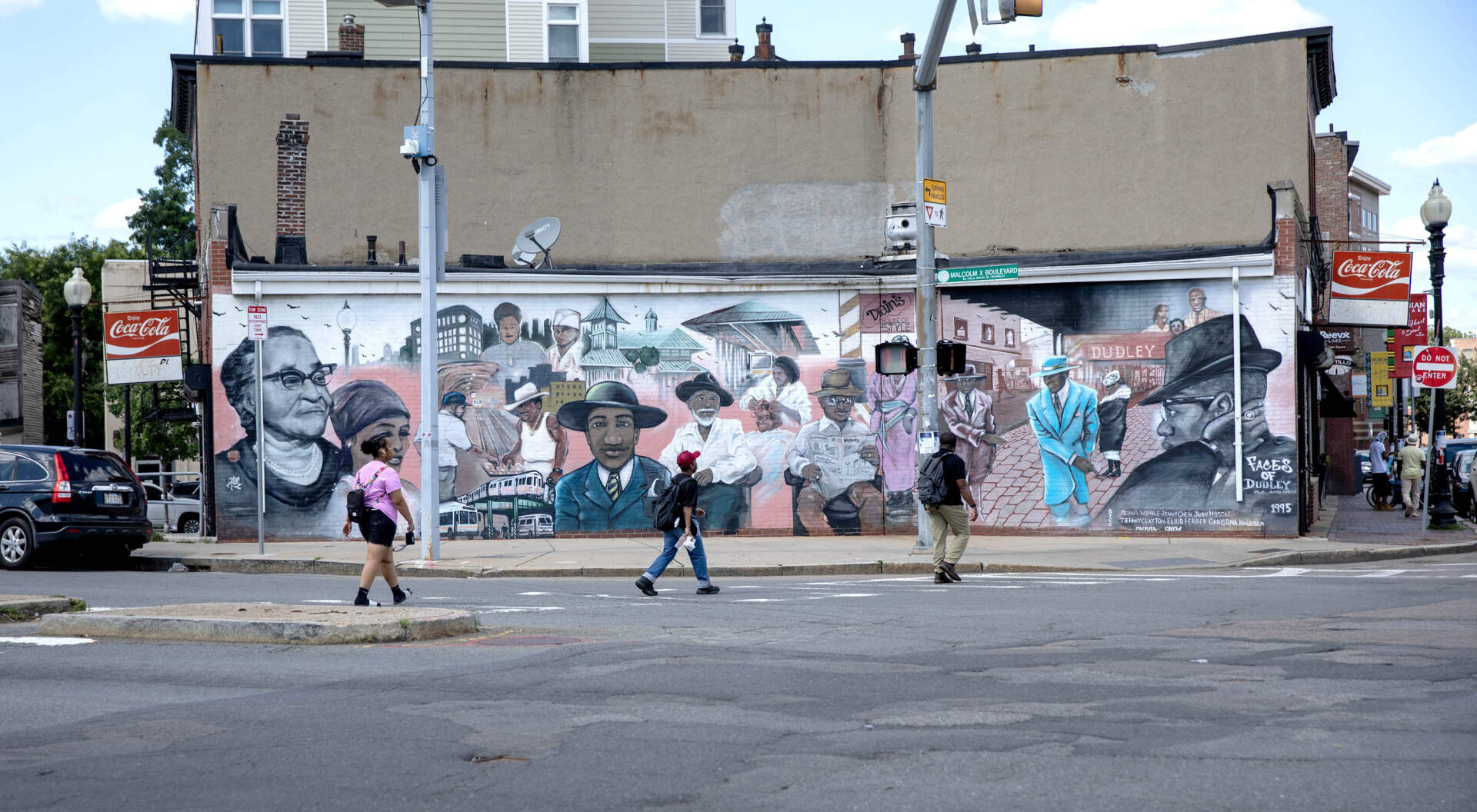 The &quot;Faces of Dudley&quot; mural, on Malcolm X Boulevard in Roxbury's Nubian Square. (Robin Lubbock/WBUR)