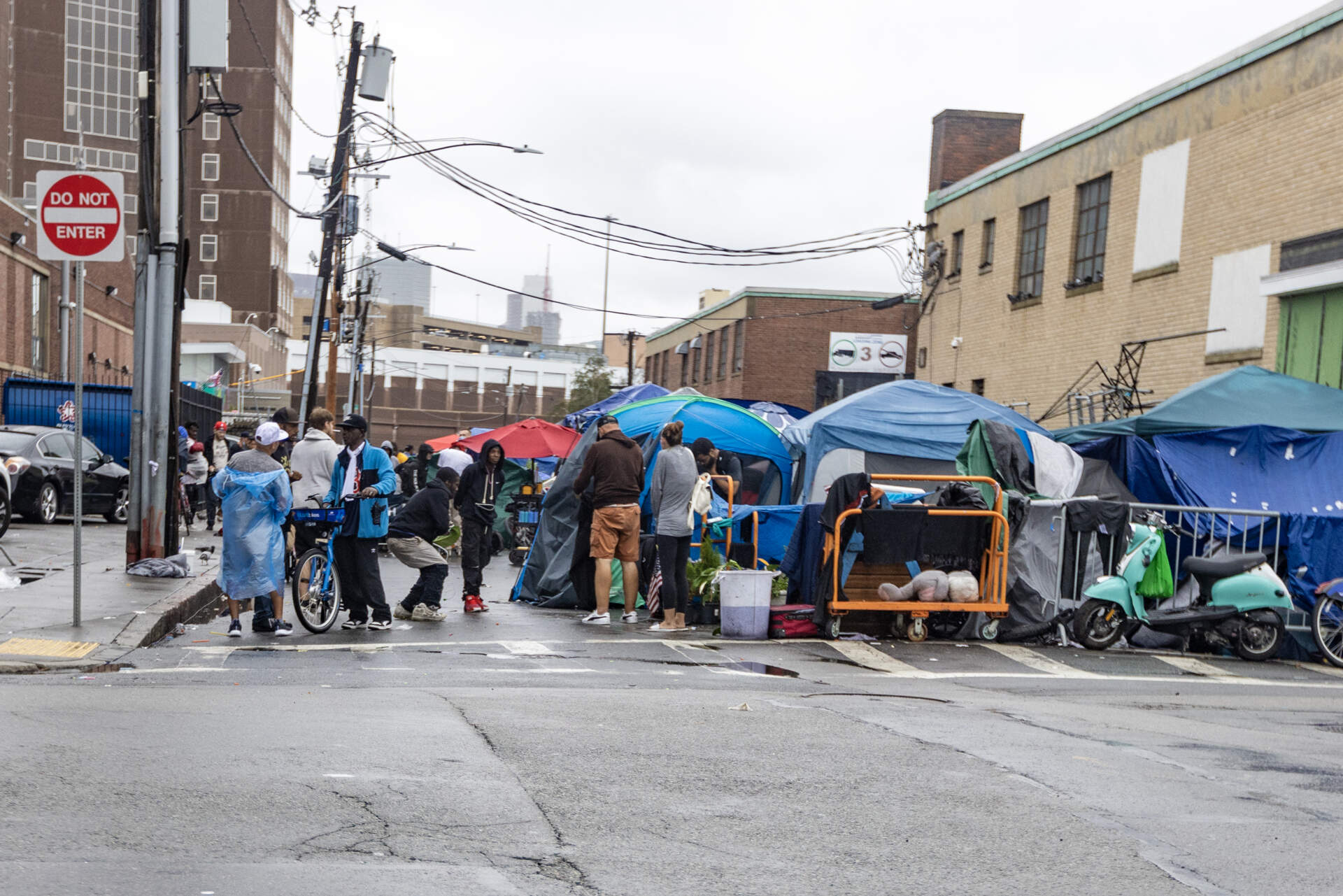 People at the tent encampment on Atkinson Street in the area known as "Mass. and Cass," Aug. 25, 2023. (Jesse Costa/WBUR)