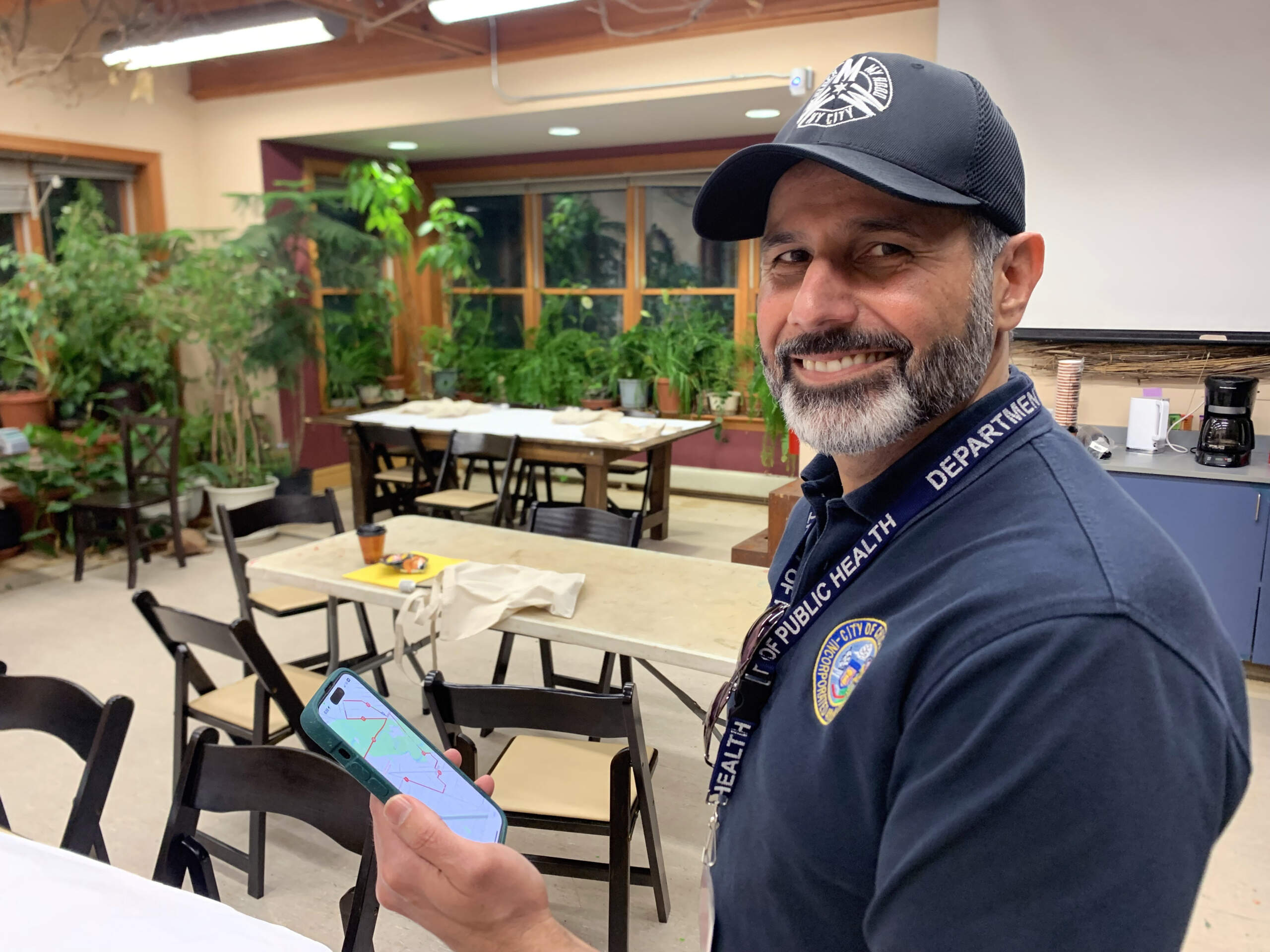 Raed Mansour, Director for the Office of Innovation at the Chicago Department of Public Health, at the North Park Village Nature Center for an early-morning heat watch event in July. (Chris Bentley/Here & Now)