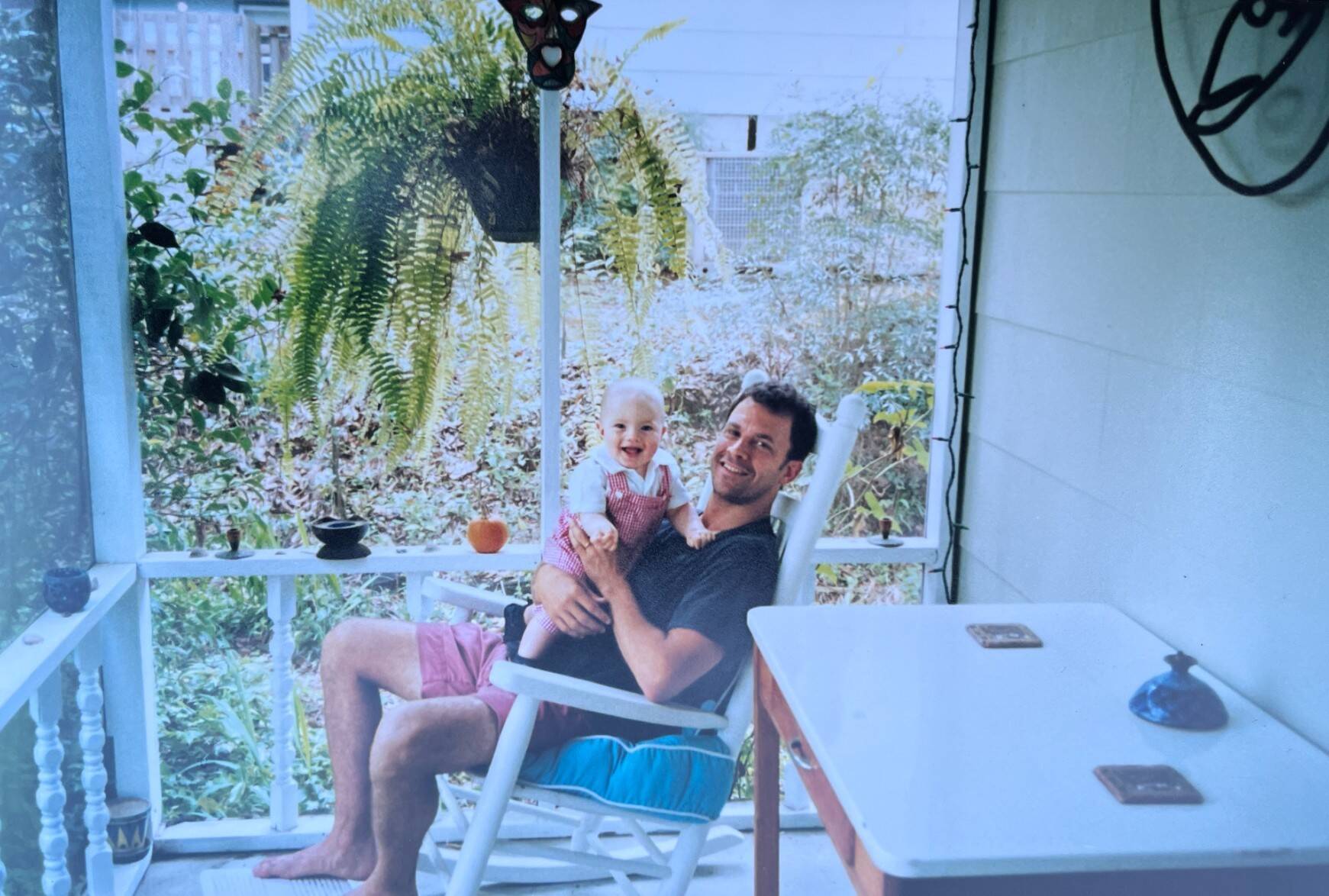 Bill Eville, in one of his black t-shirts, and his son, Hardy, on the porch circa 2003. (Courtesy Bill Eville)