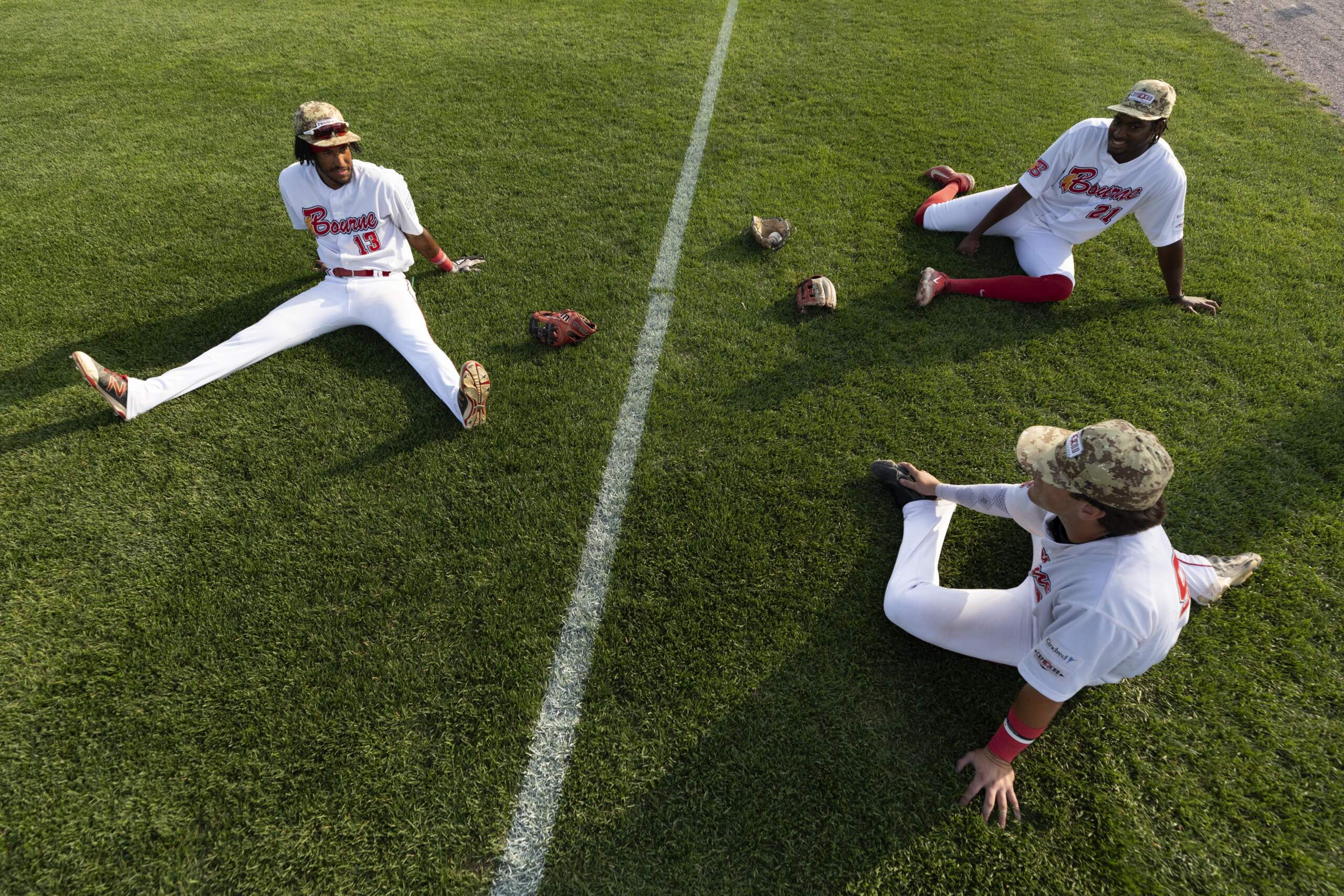 Bourne Braves players warm up before a Cape Cod League baseball game against the Chatham Anglers, Wednesday, July 12, 2023, in Bourne, Mass. (Michael Dwyer/AP)