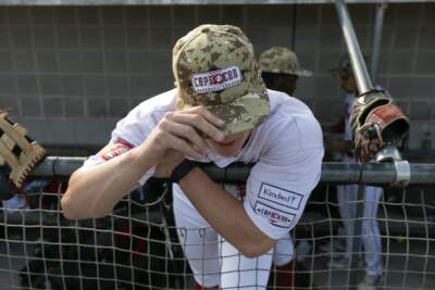 Bourne Braves' Sam Petersen stands in the dug out before a Cape Cod League baseball game against the Chatham Anglers, Wednesday, July 12, 2023, in Bourne, Mass. (Michael Dwyer/AP)