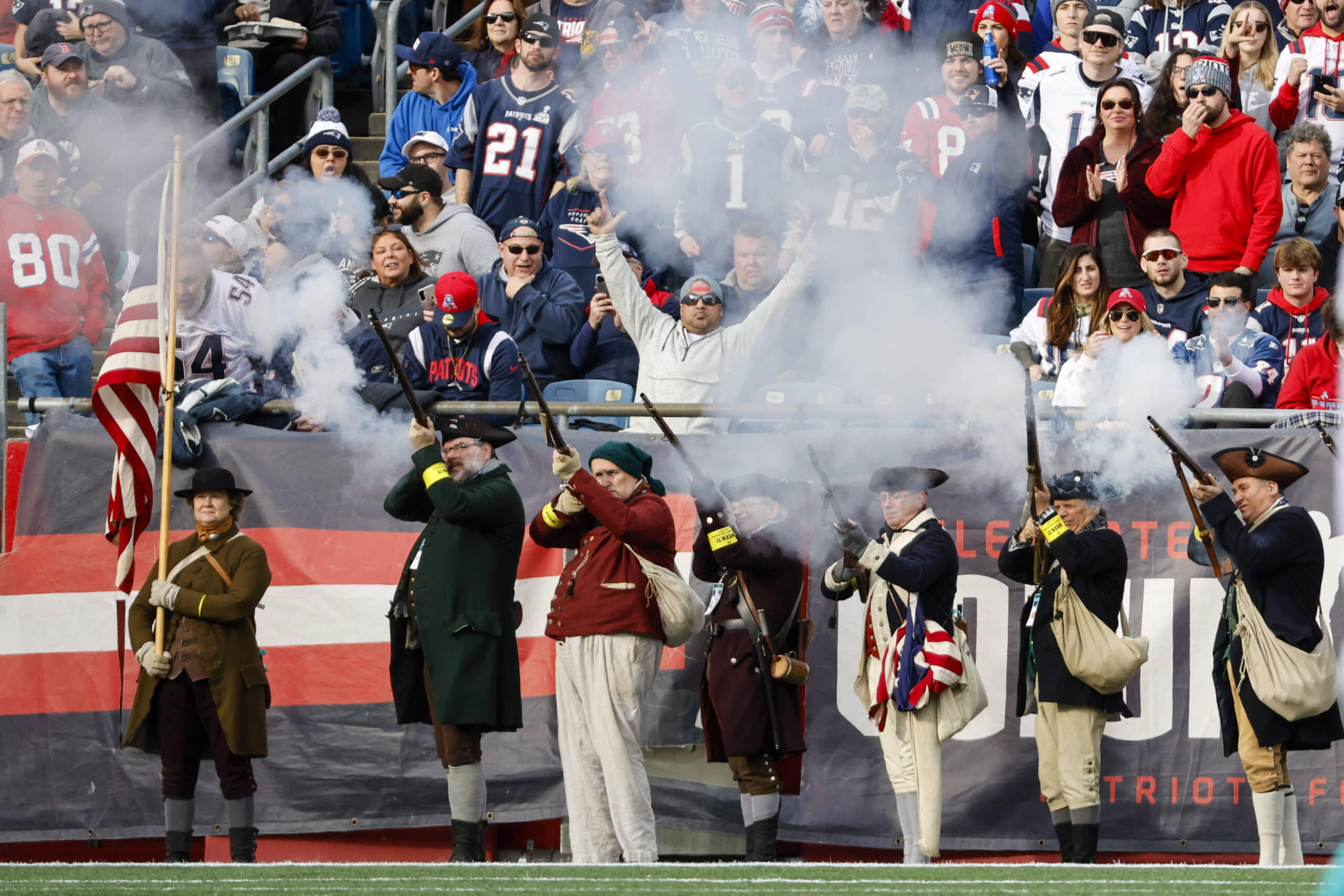 New England Patriots end zone Militia fire a volley before the start of an NFL football game between the New England Patriots and the Miami Dolphins, in Foxborough, Mass. (Greg M. Cooper/AP)