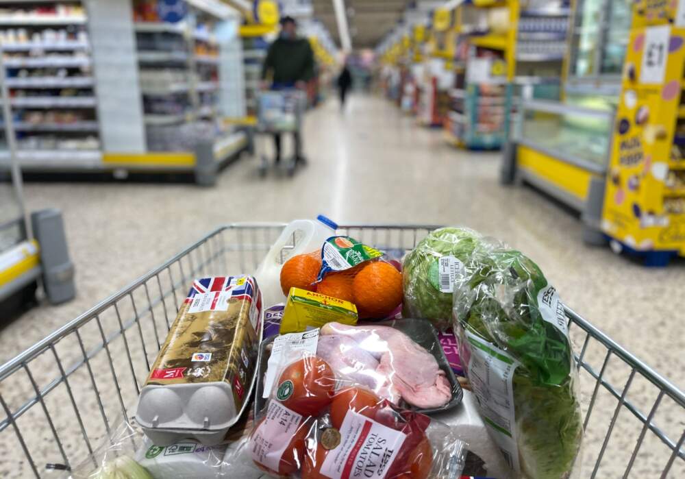 Food items are pictured loaded into a shopping trolley inside a supermarket. (Daniel Leal/AFP via Getty Images)