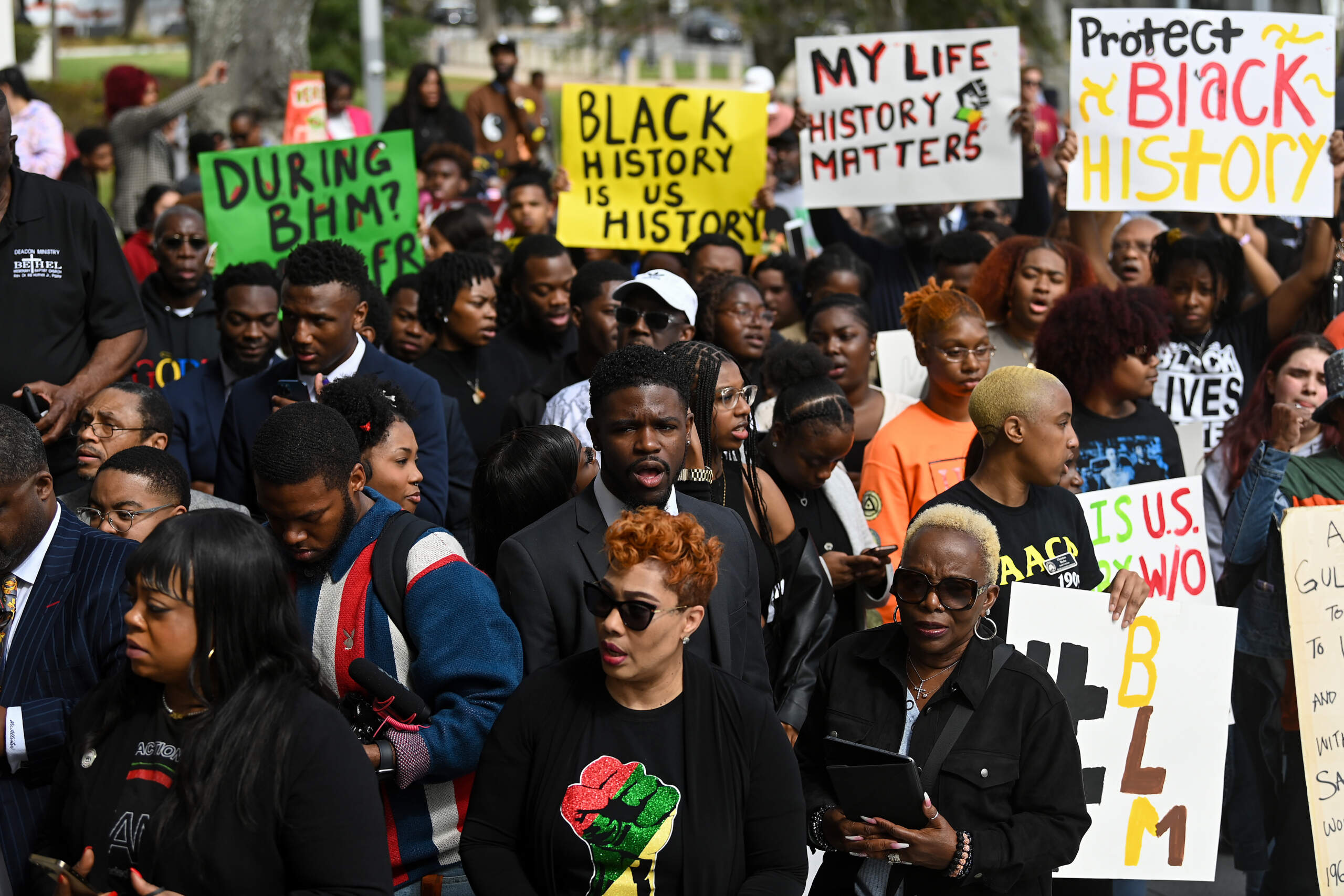 Demonstrators protest Florida Governor Ron DeSantis' plan to eliminate Advanced Placement courses on African American studies in high schools as they stand outside the Florida State Capitol on Feb. 15, 2023 in Tallahassee, Florida. (Photo by Joshua Lott/The Washington Post via Getty Images)