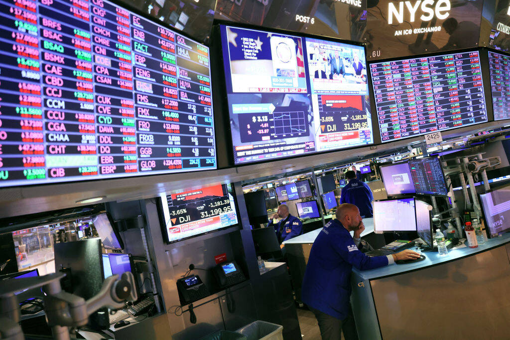 NEW YORK, NEW YORK - SEPTEMBER 13: Traders work on the floor of the New York Stock Exchange during afternoon trading on September 13, 2022 in New York City. U.S. stocks opened lower today and closed significantly low with the Dow Jones dropping over 1,200 points after the release of an inflation report that showed prices rising more than expected in the last month. The Consumer Price Index released by the Bureau of Labor Statistics showed prices rising 8.3% over the last year, for which economists had predicted an 8.1% increase. (Photo by Michael M. Santiago/Getty Images)