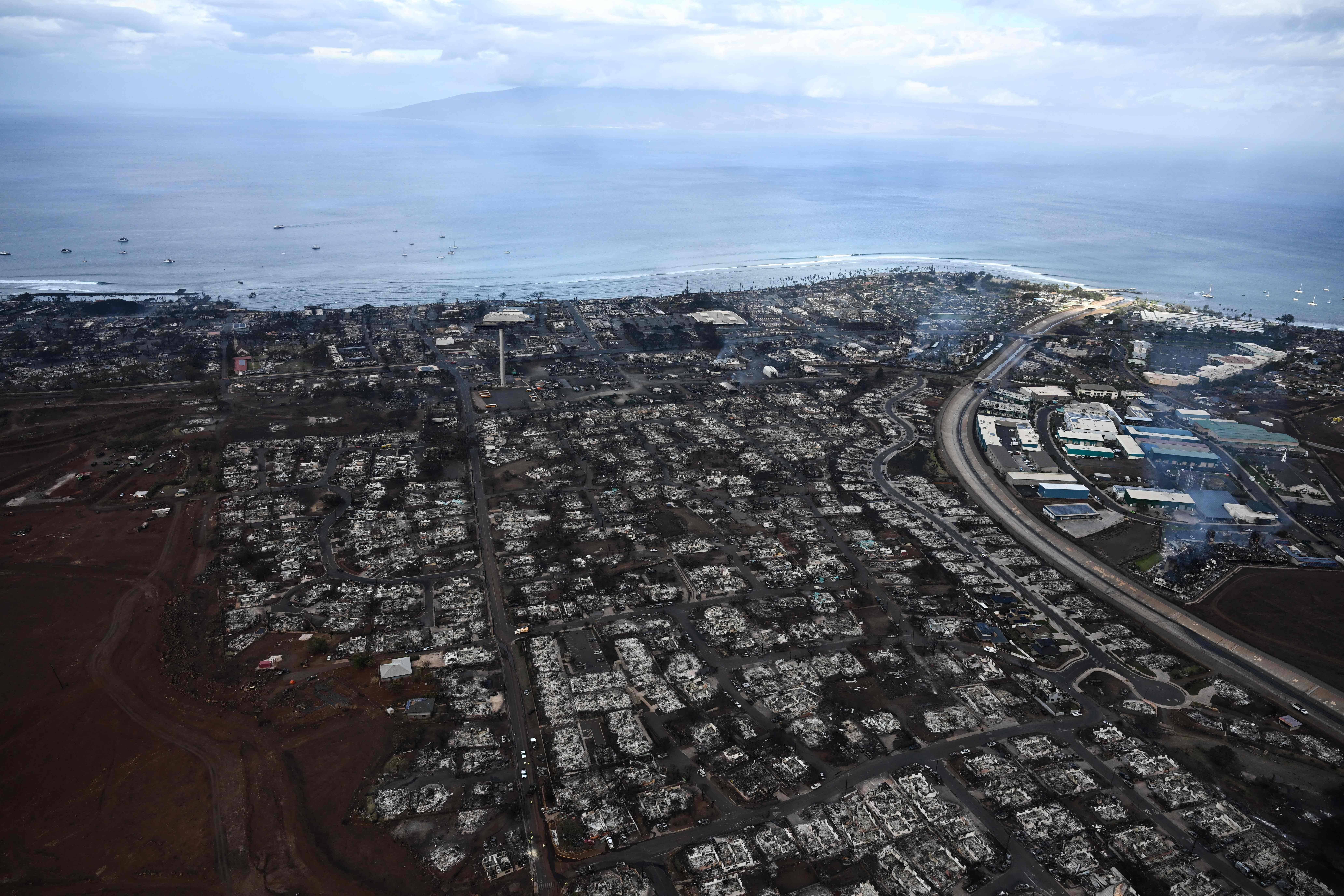 An aerial image taken on Aug. 10, 2023 shows destroyed homes and buildings burned to the ground in Lahaina after wildfires in western Maui, Hawaii. A terrifying wildfire that left a historic Hawaiian town in charred ruins is one of the deadliest disasters in the state's history. (Patrick T. Fallon / AFP via Getty Images)