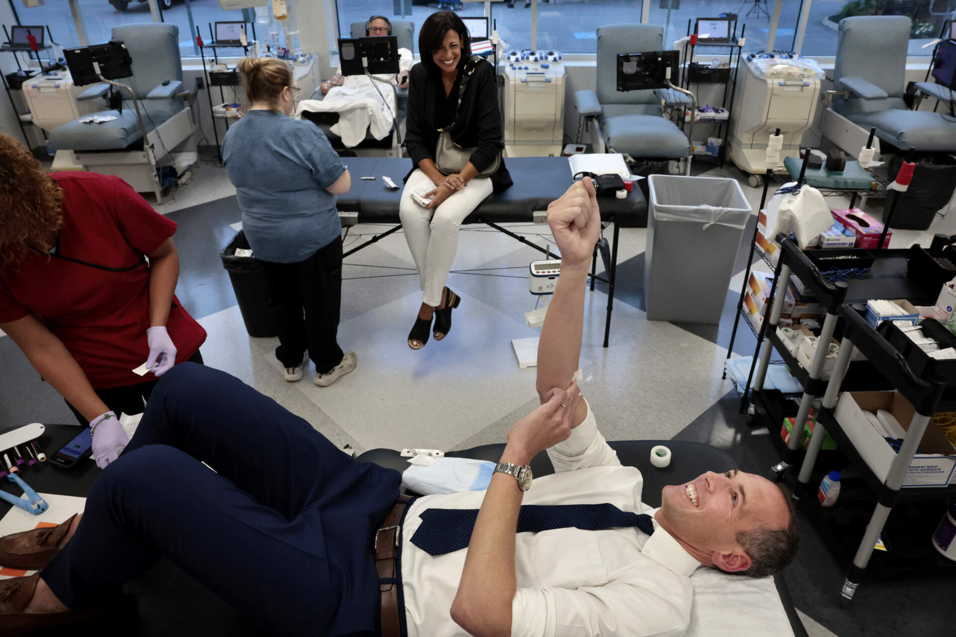 Dr. Robbie Goldstein, front, and Dr. Rochelle Walensky, seated, chat after donating blood at the American Red Cross Blood Donation Center on August 29th, 2023. (Craig F. Walker/The Boston Globe via Getty Images)