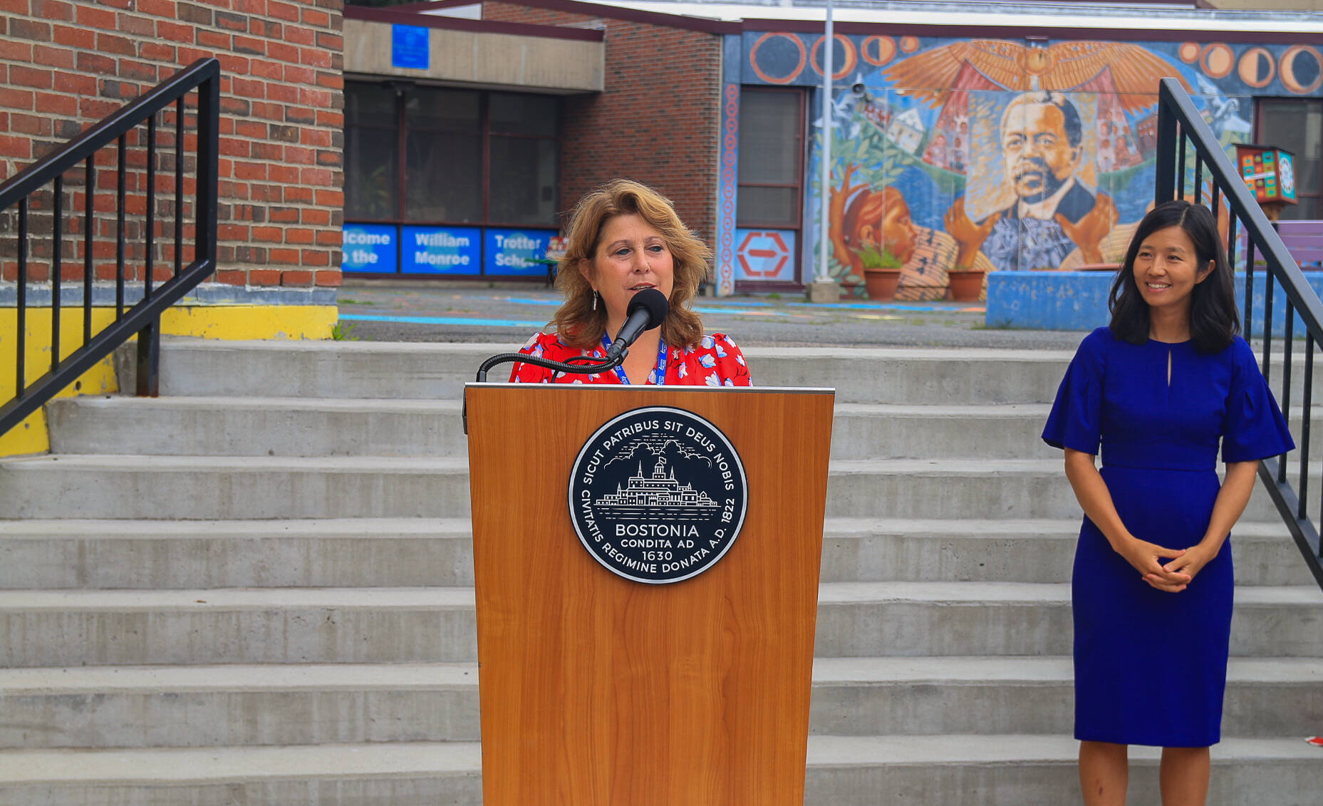 Superintendent Mary Skipper and Mayor Michelle Wu outside Trotter Elementary in Roxbury. (Emily Piper-Vallillo/WBUR)