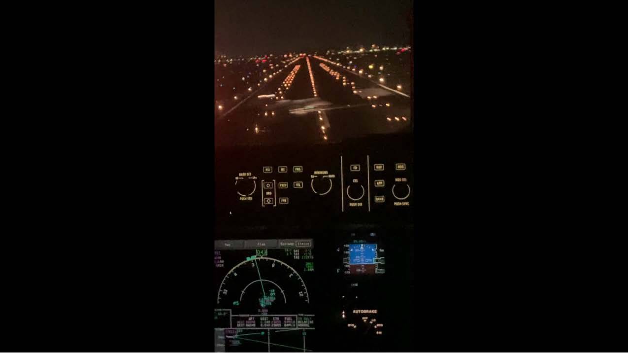 A screenshot from a video taken from the JetBlue cockpit showing the moment the Learjet crossed the runway in front of the JetBlue plane. (National Transportation Safety Board )